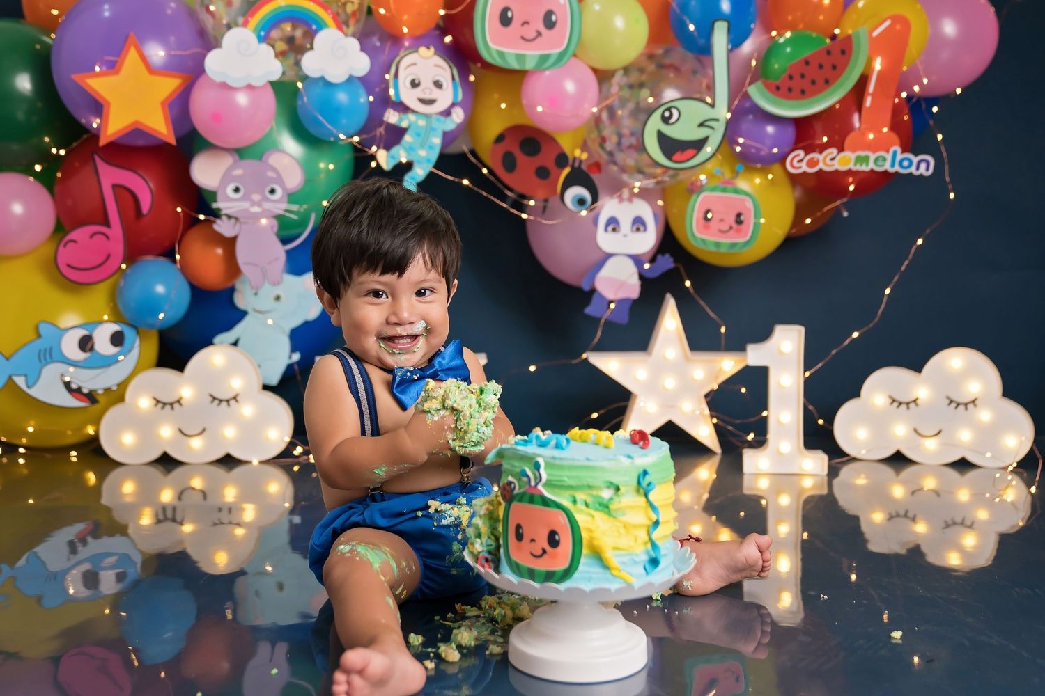 Festive balloon display featuring animated character designs and illuminated star decorations.