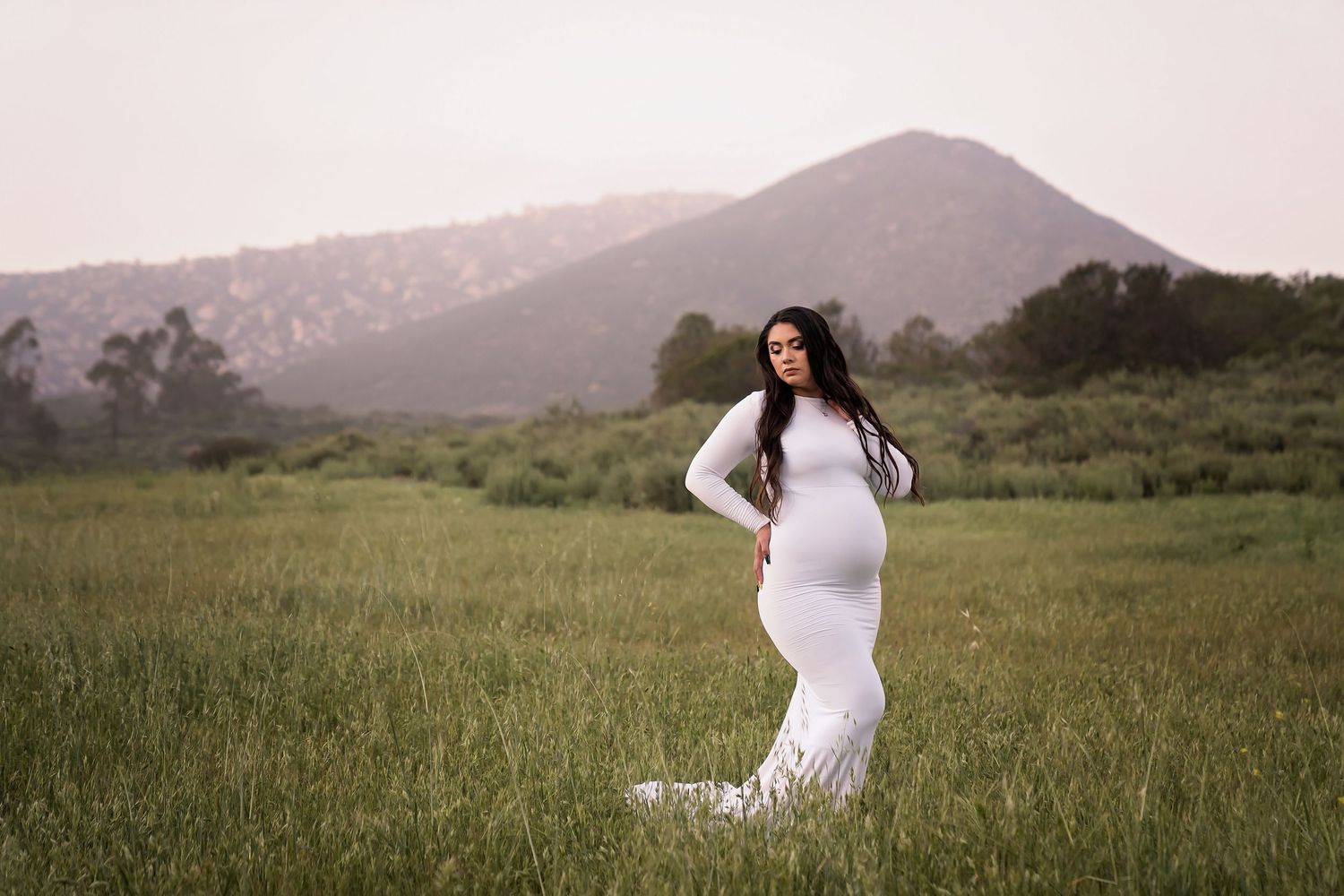 Dreamy maternity portraits taken in an open field at sunset. San Diego Maternity Photographer