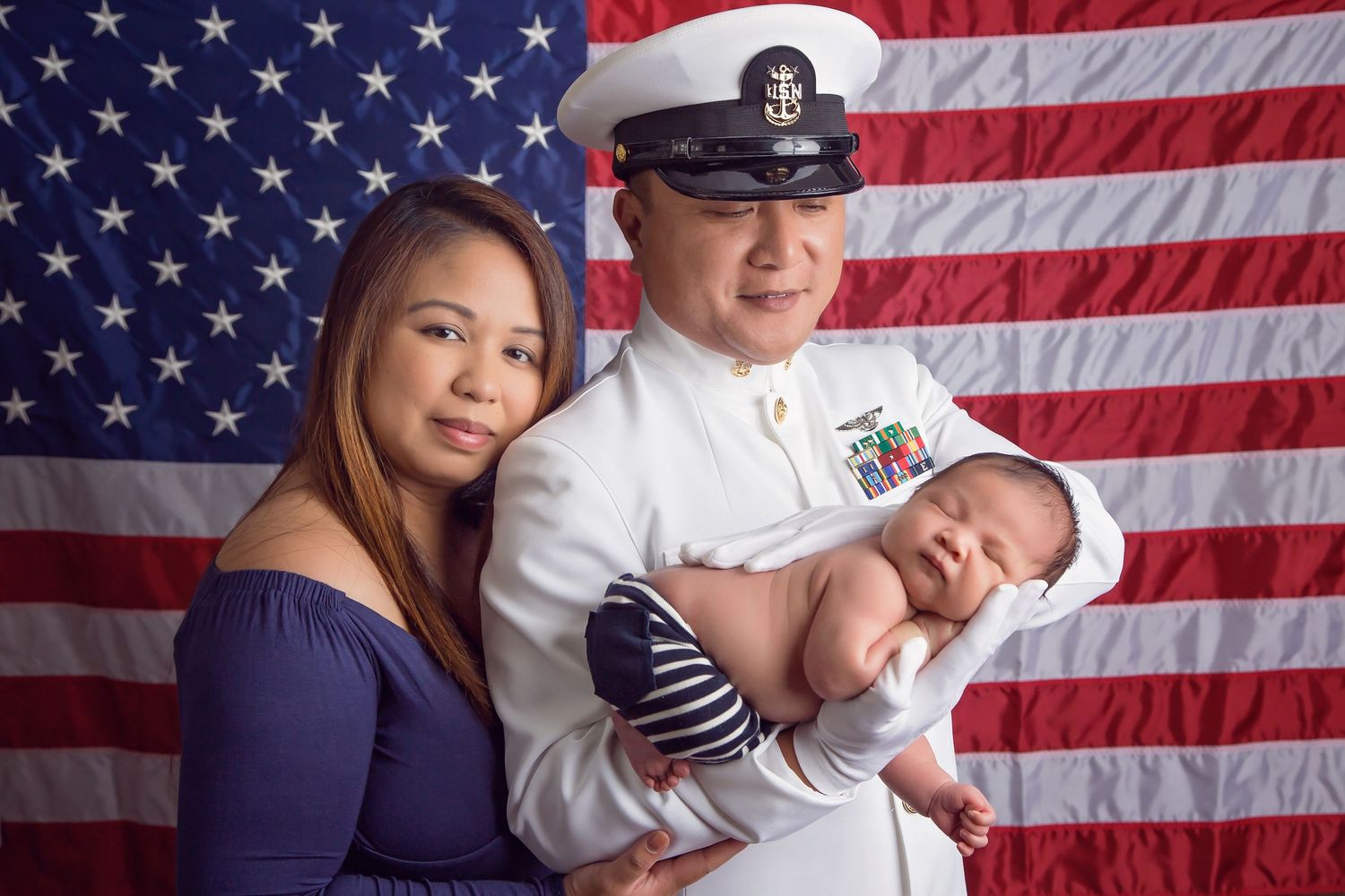 Military family portrait session with American flag backdrop. San Diego Newborn Photographer