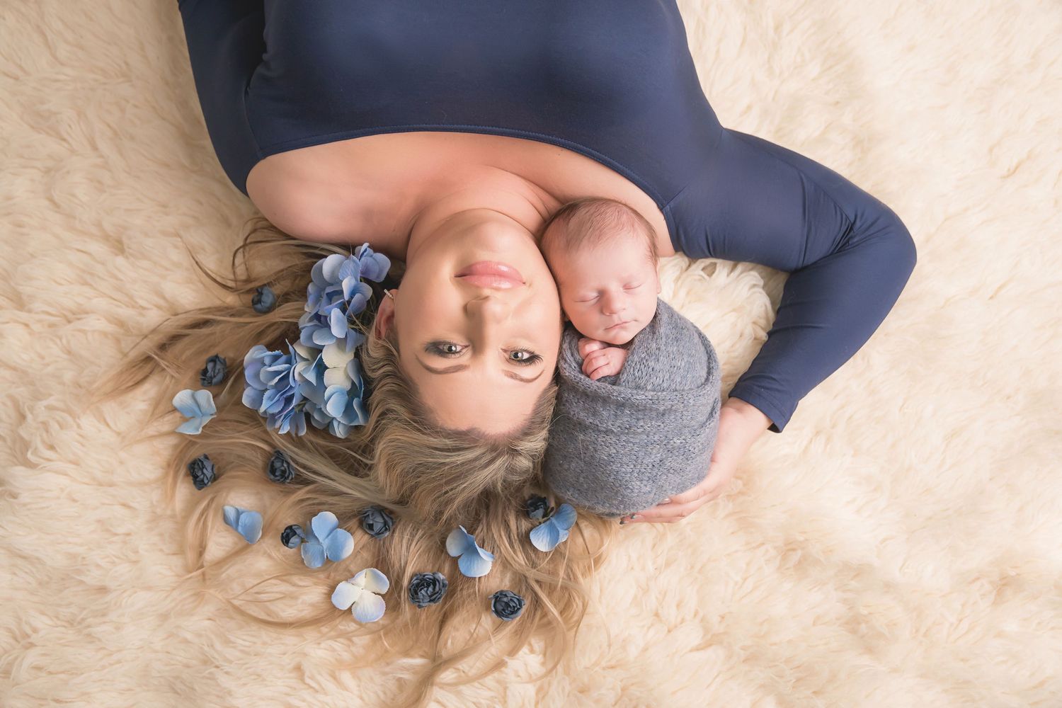 Navy blue fabric creates elegant backdrop for newborn portrait series. San Diego Newborn Photographer