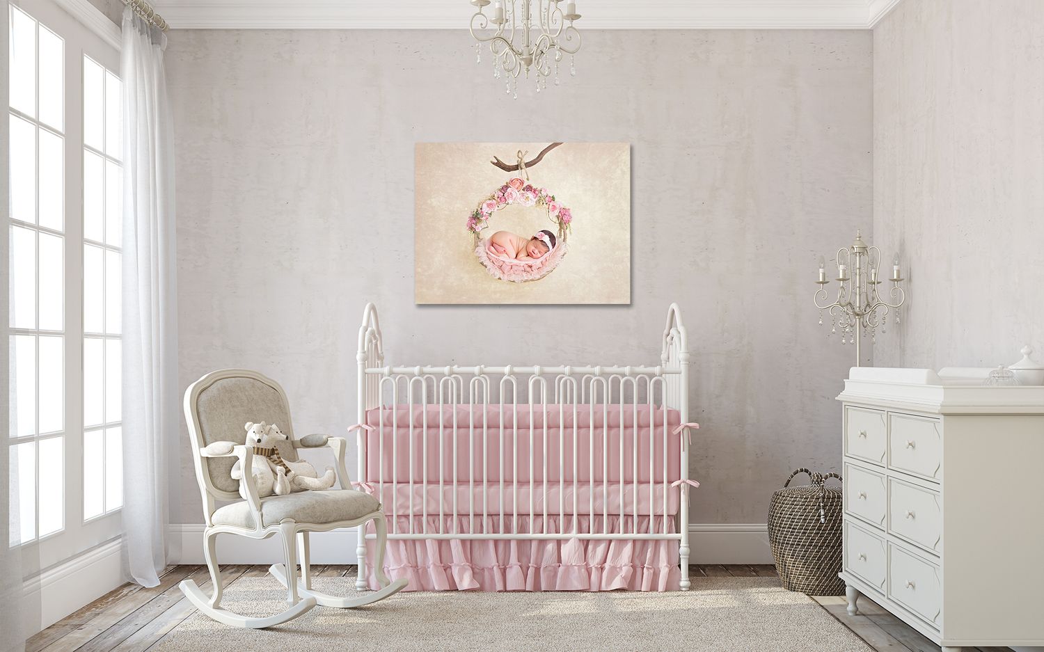 Panoramic view of an elegant nursery room with soft pink and white decor, featuring a crib and rocking chair. San Diego Newborn Photographer