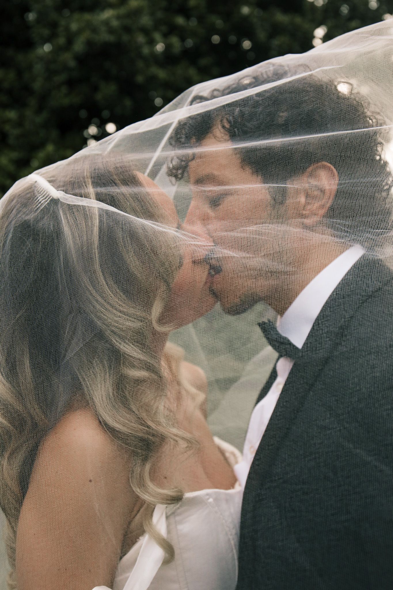 Bride and groom share a kiss