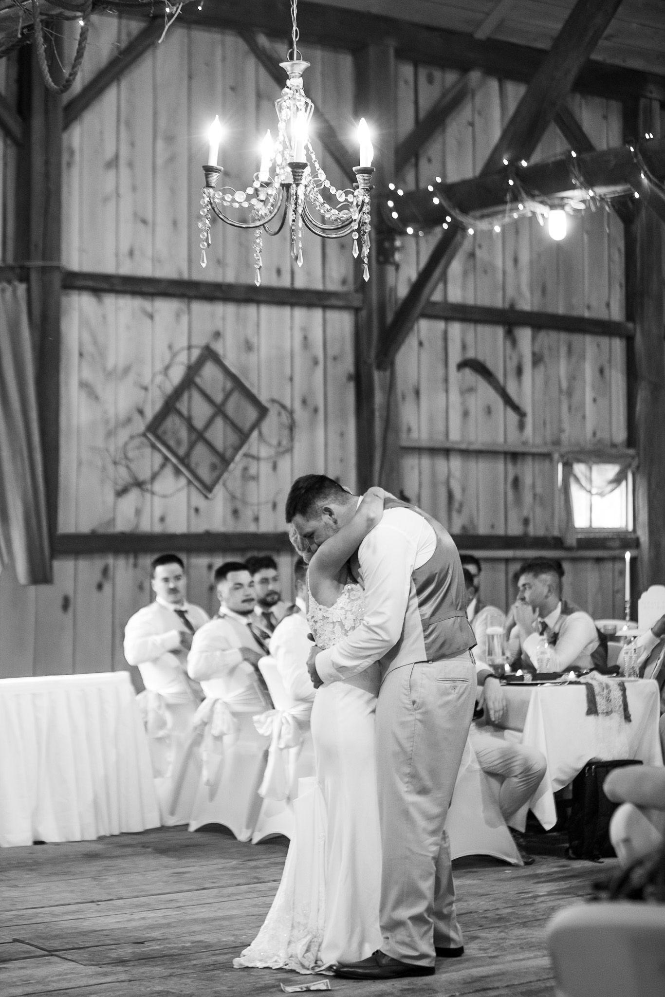 bride and groom black and white picture during their first dance