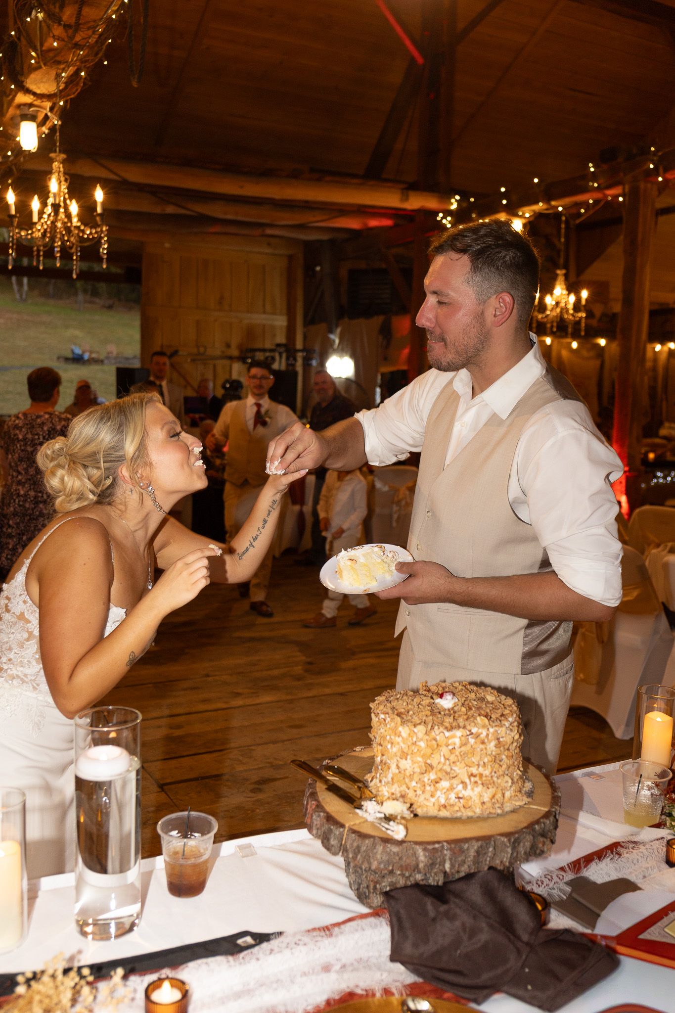 bride and groom feeding each other cake