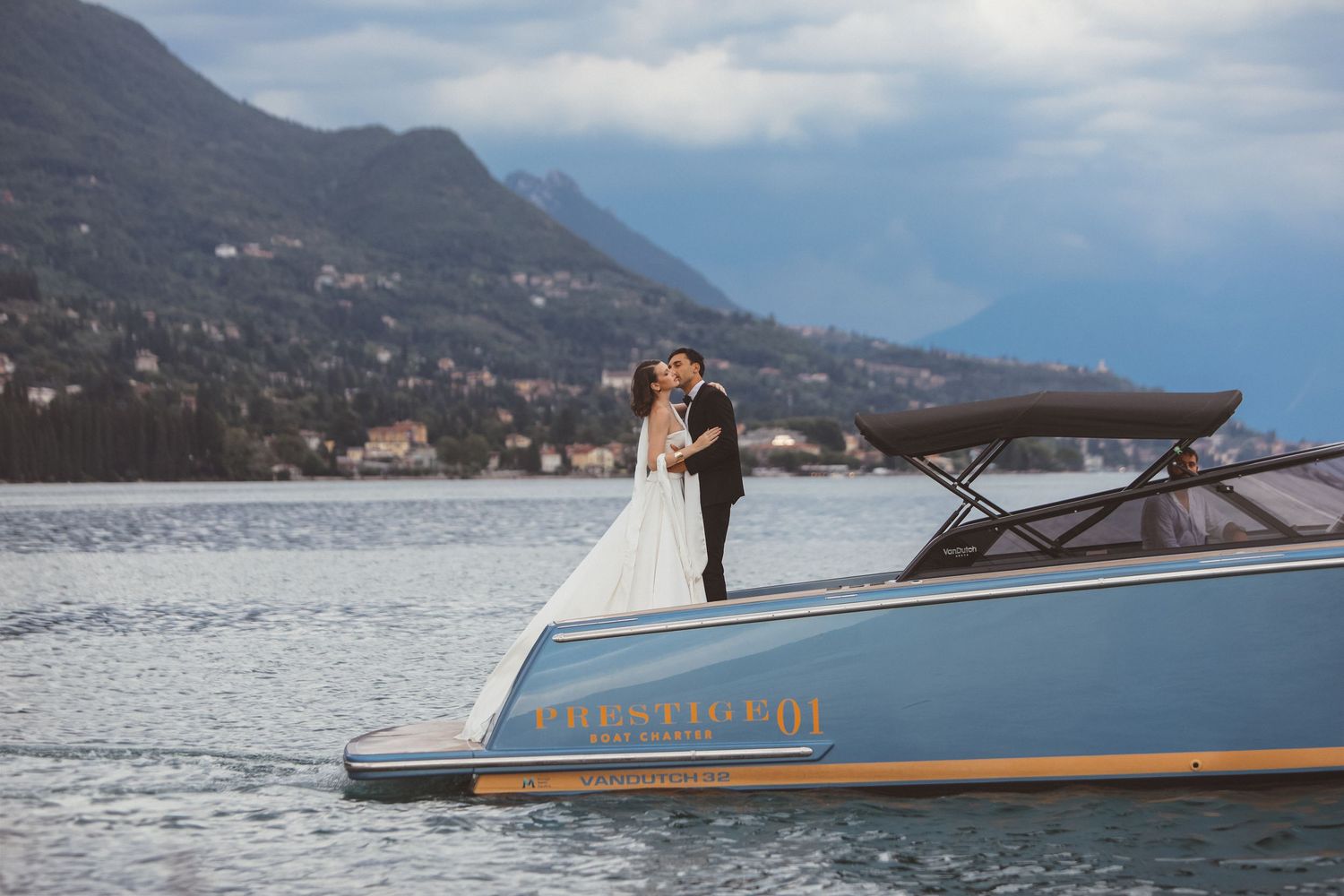 Recently married couple celebration photoshoot on a boat in Lake Garda, Italy