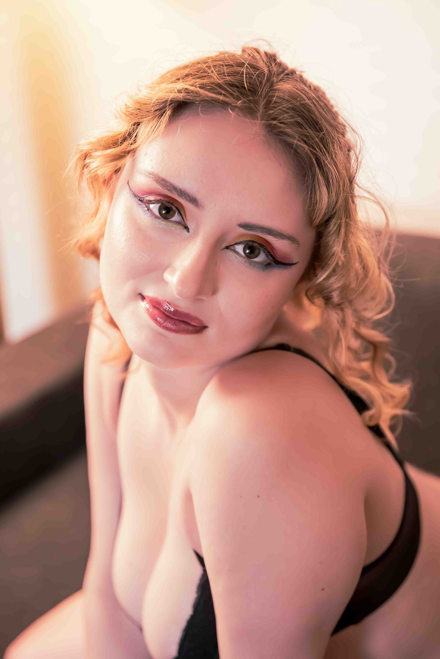 Boudoir photo with a model in black lingerie