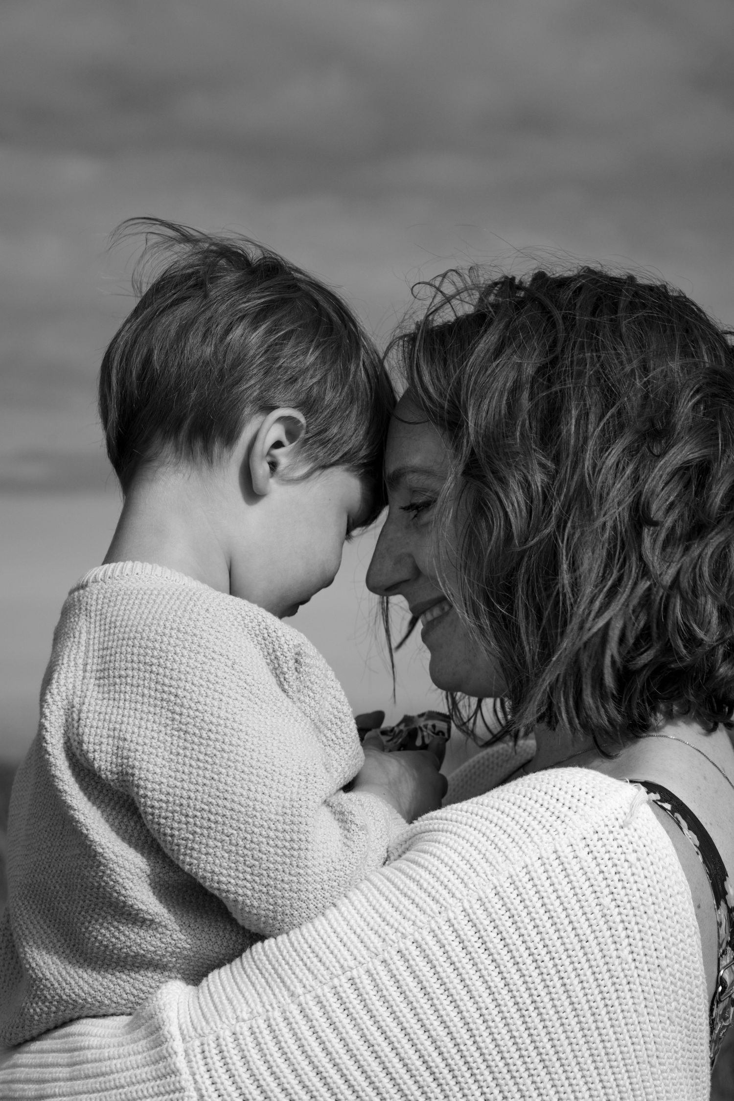 A tender black and white photo sequence shows two people sharing intimate moments together.
