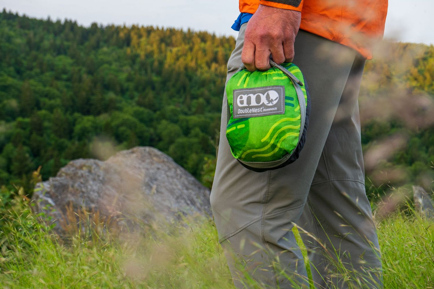 Outdoor gear and hiking equipment displayed against natural terrain.
