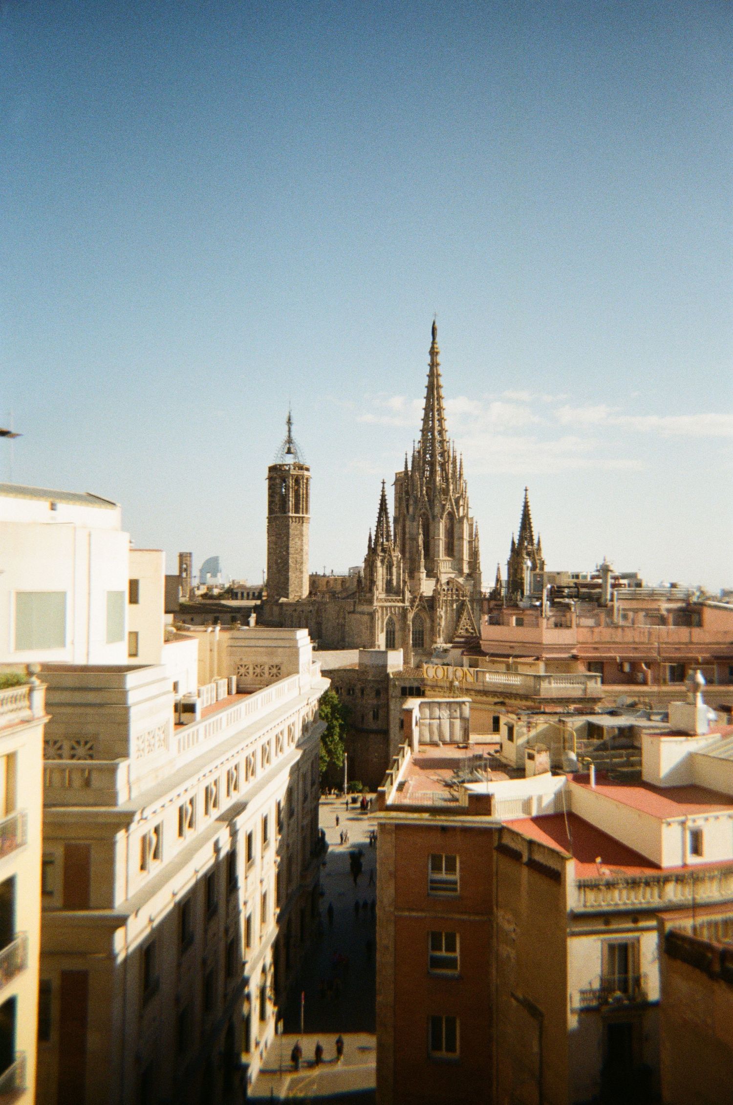 Panoramic cityscape of Barcelona showing Gothic Quarter architecture and cathedral spires.