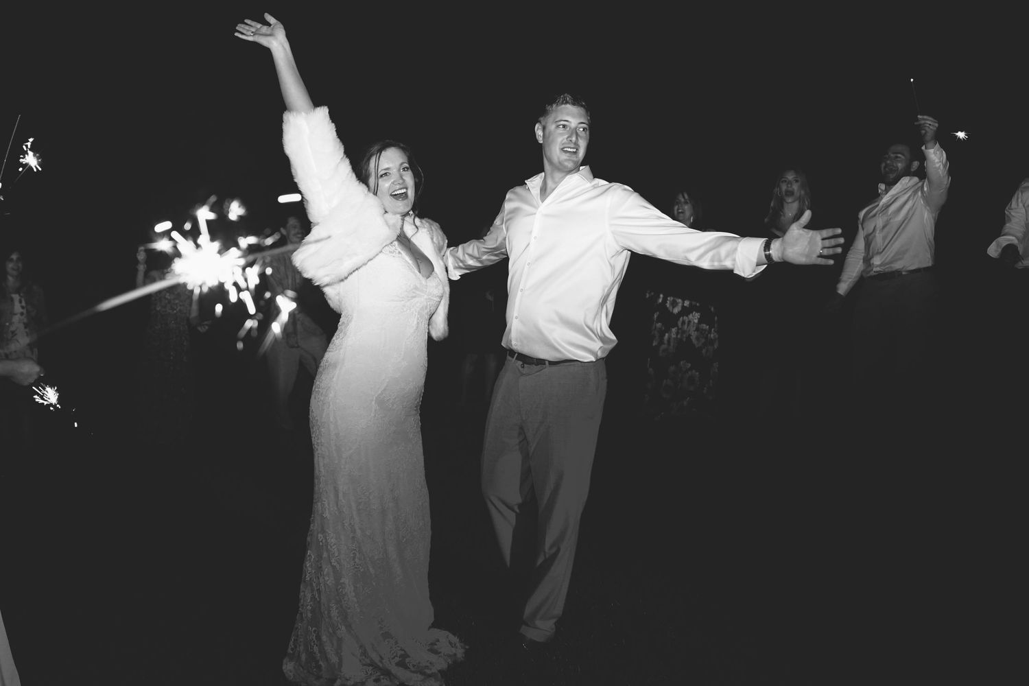A group of people dancing together in a black and white photograph from what appears to be the 1950s.