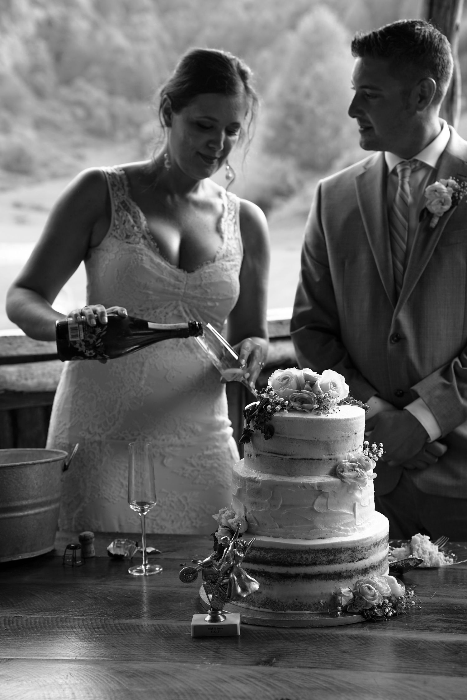 A black and white sequence of wedding cake cutting photos showing the traditional cake-cutting moment at a reception.