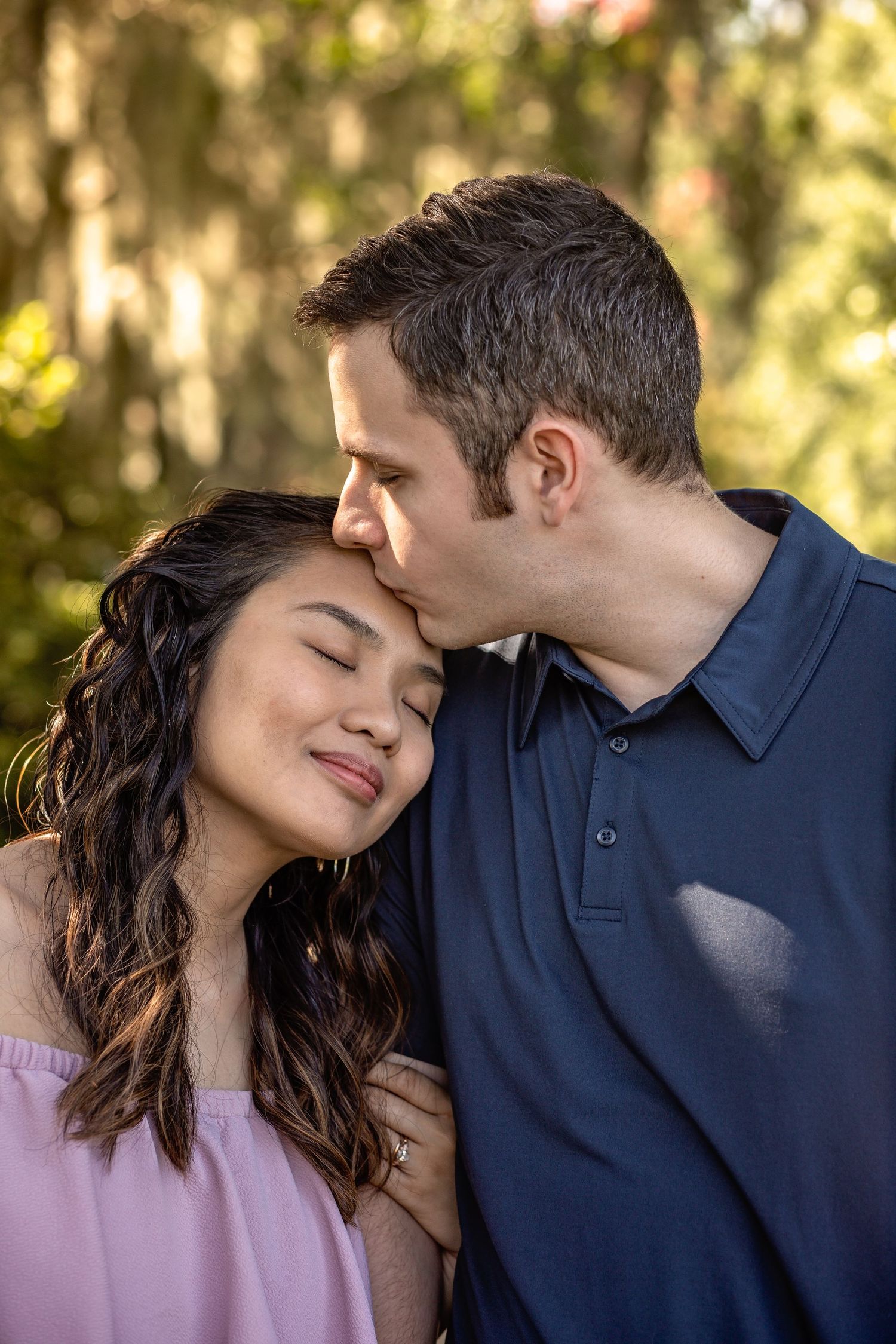 Romantic close-up shots of a couple sharing tender moments in a sunlit garden.