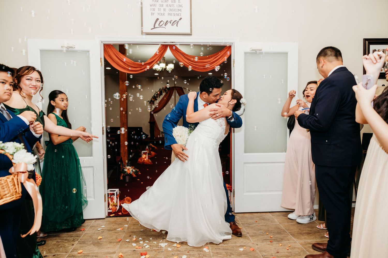 Wedding reception dance party with guests celebrating on dance floor.