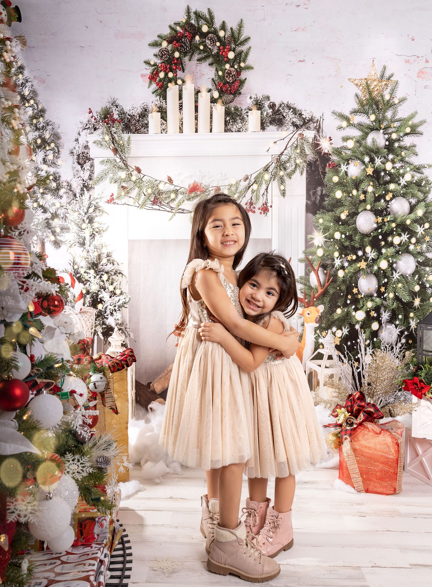 White Christmas photo scene with decorated trees, presents, and cream-colored decor.