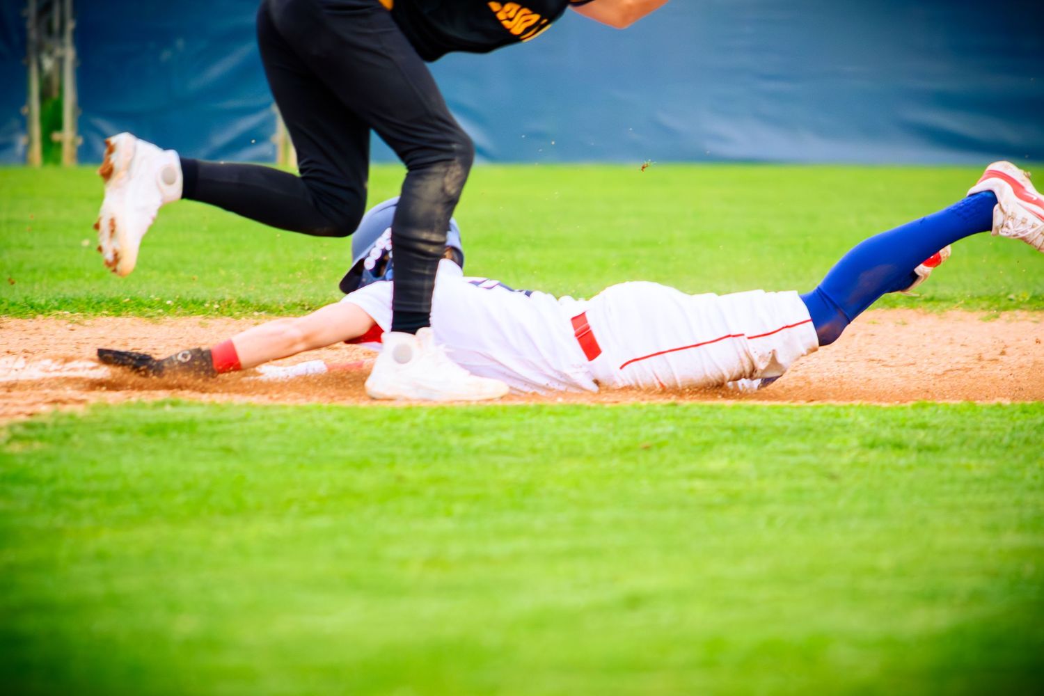 Players positioned on baseball field during game action.