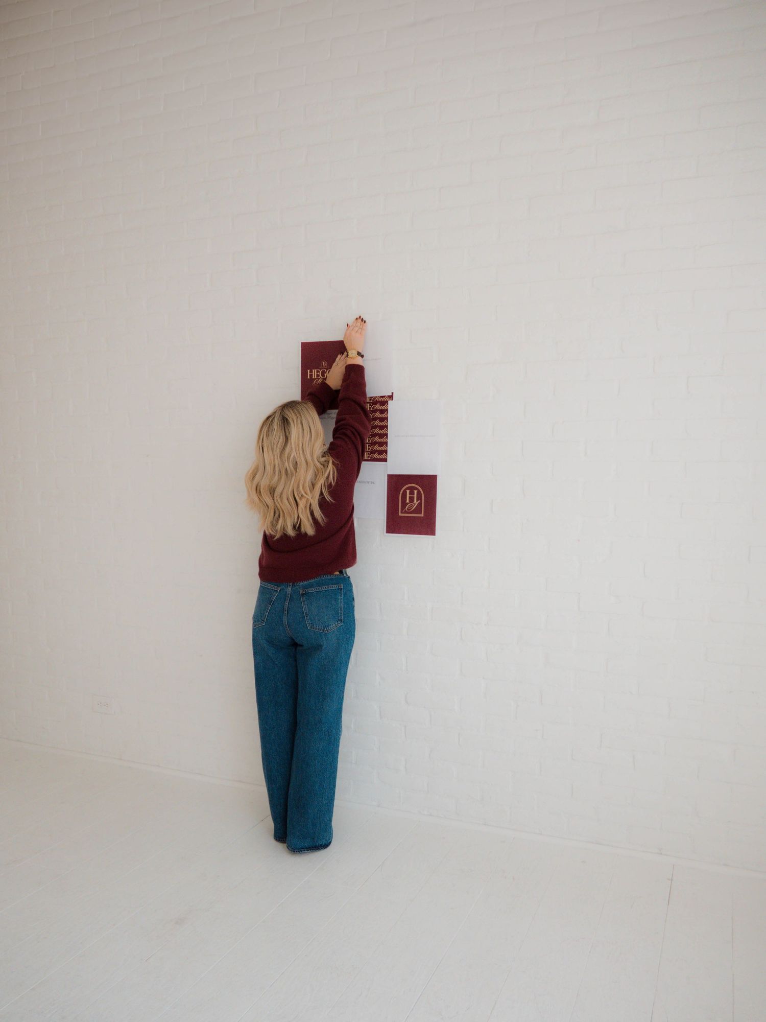 Multiple panels show a person in jeans standing against a white wall, captured from different perspectives and distances.