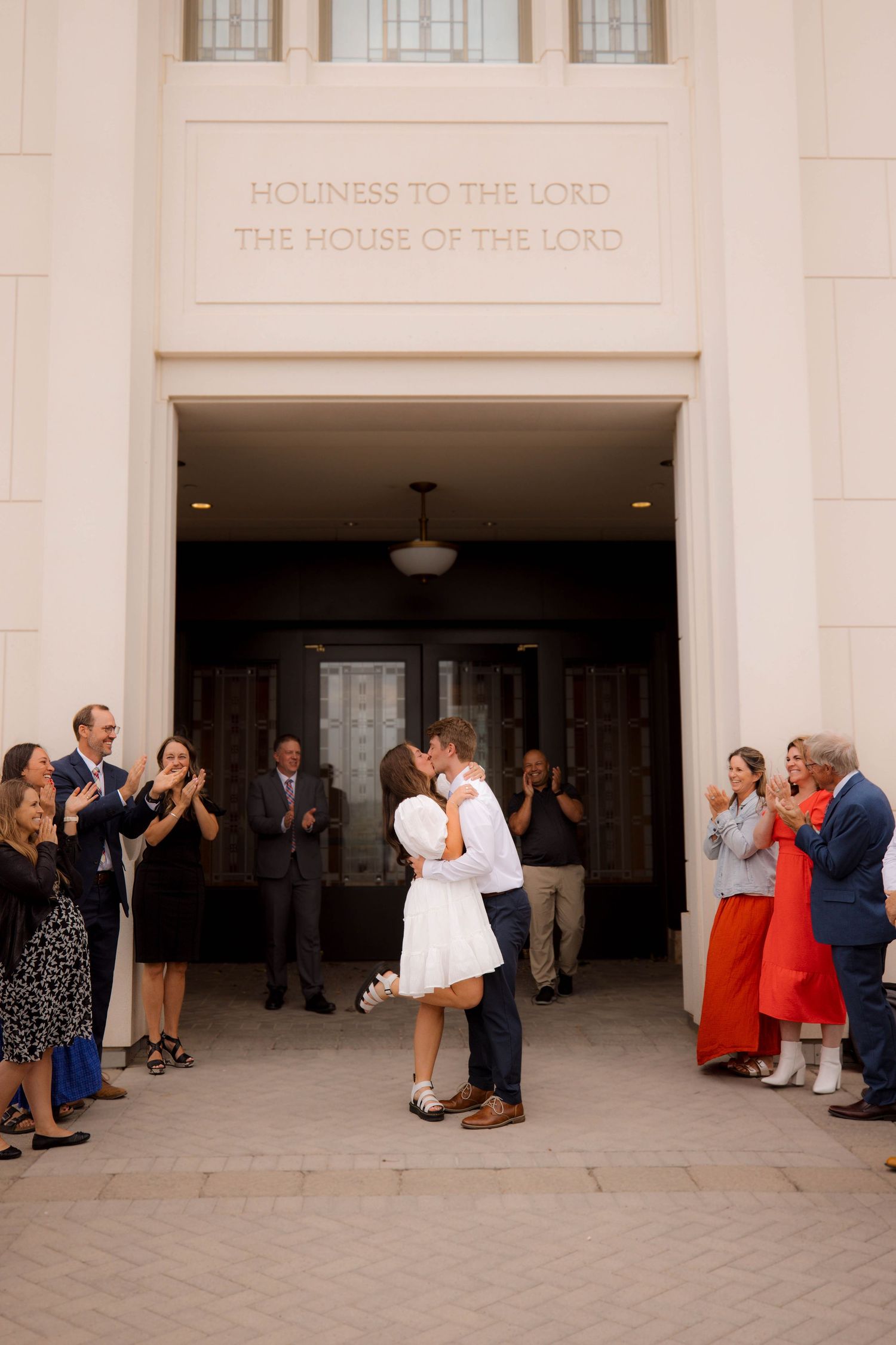 Panoramic photo sequence showing wedding guests lined up outside entrance of religious building for receiving line ceremony.