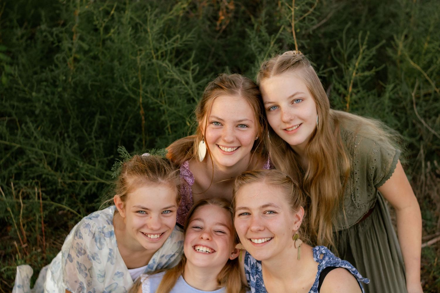 family photo, girls smiling in trees