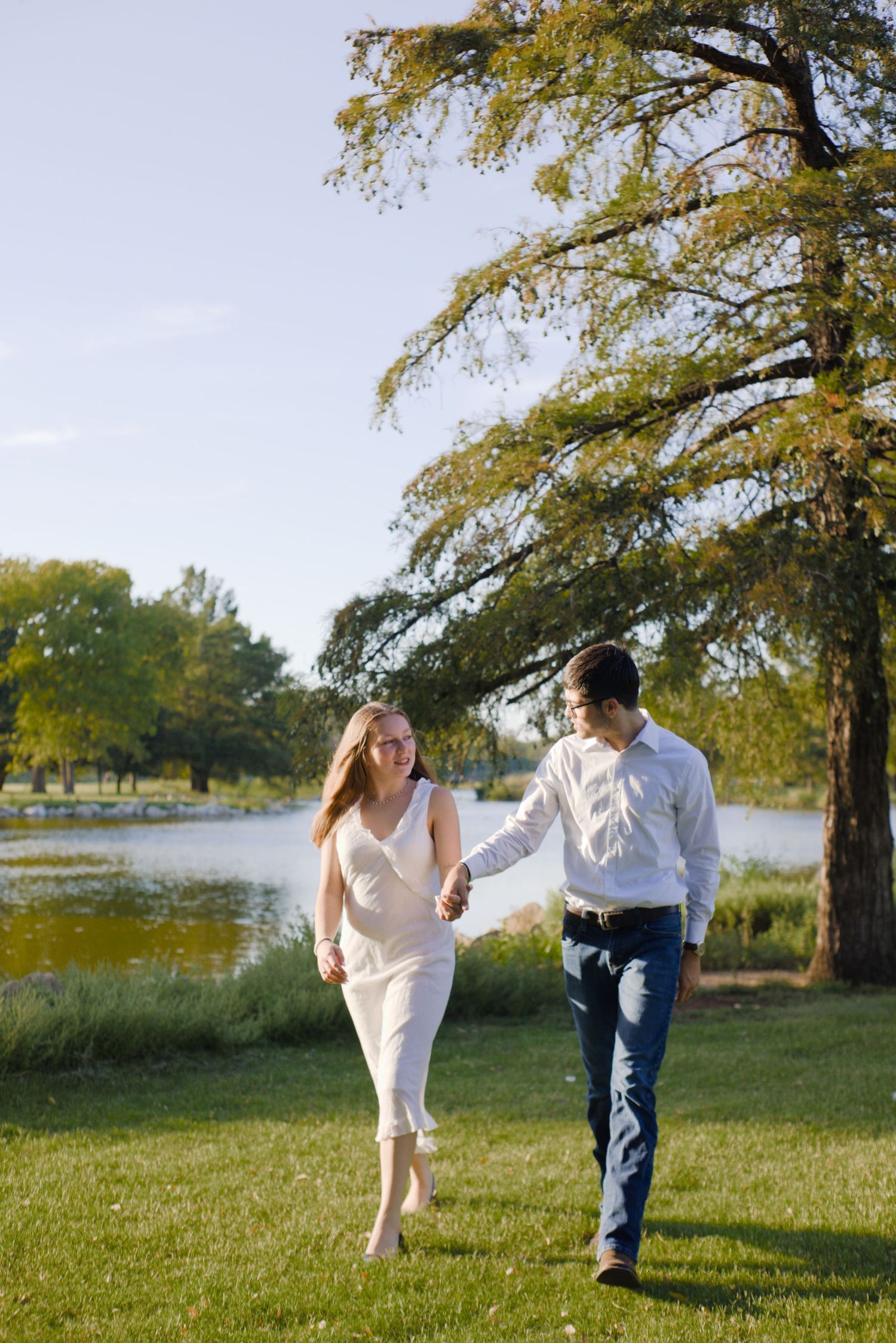 couple, engagement, walking, lake photos in Kansas City, Fort Worth Texas affordable wedding photographer, 35mm film photography