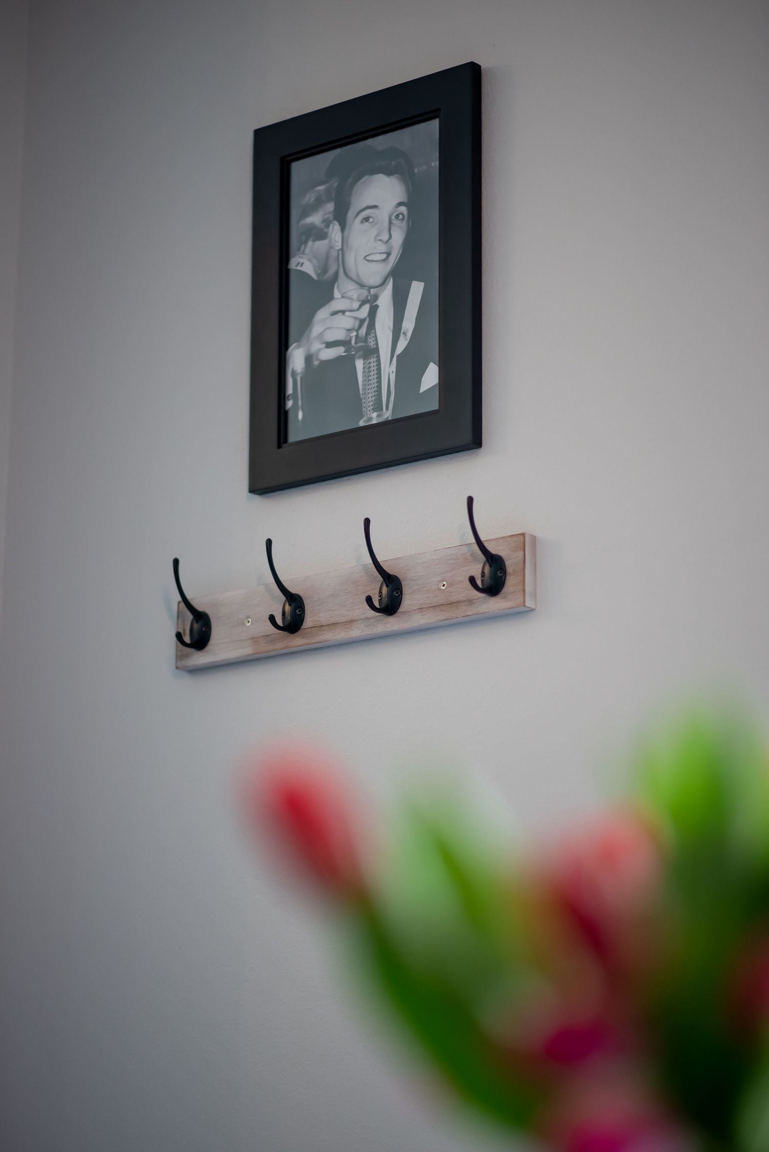 Photo of Peter Vazul on the wall of the reception area inside Vazul Hair Artistry, a salon in Ocala, FL.