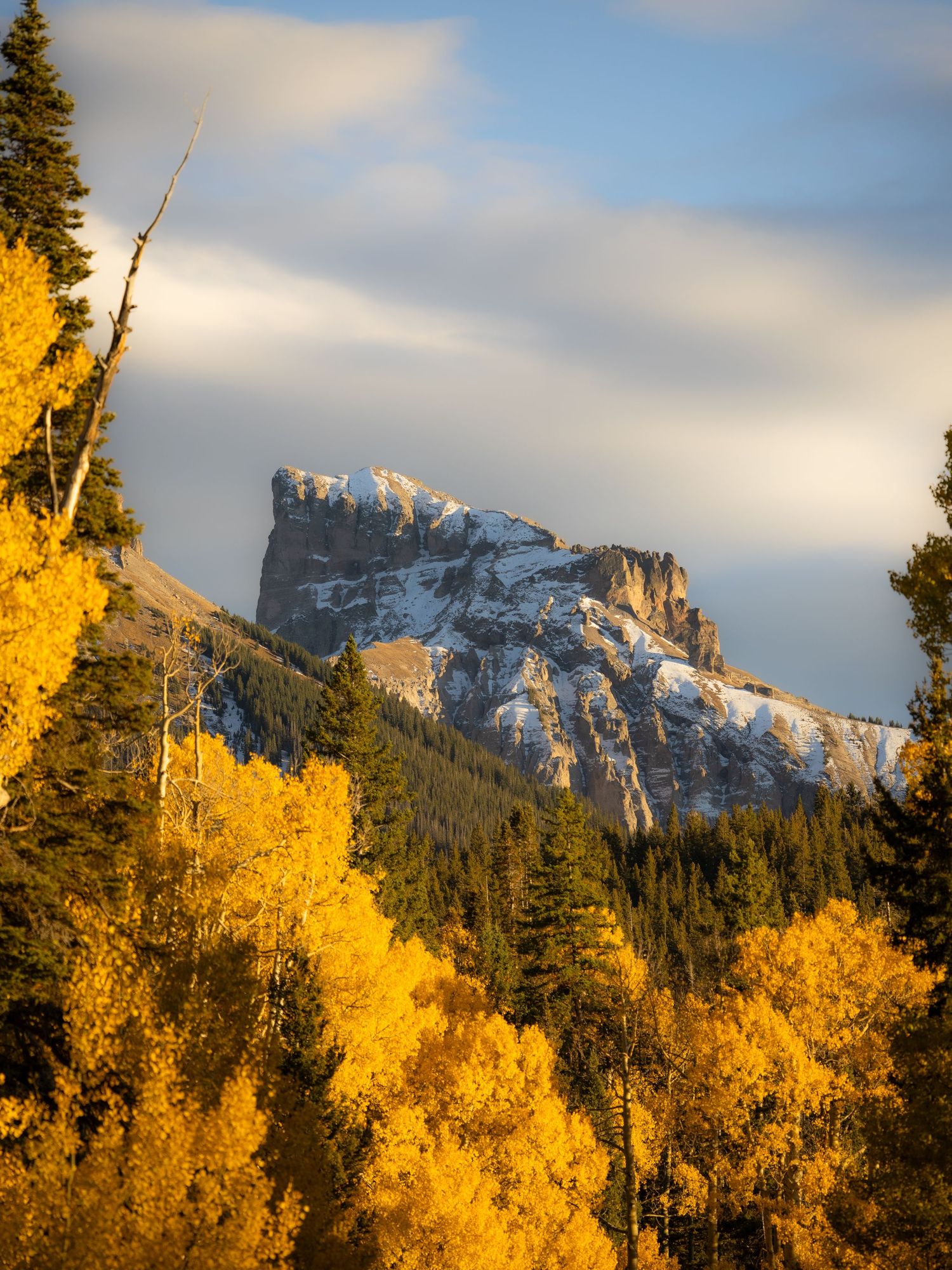 A landscape photo of Precipice Peak taken in the Cimarron Range, near Ridgway, Colorado.