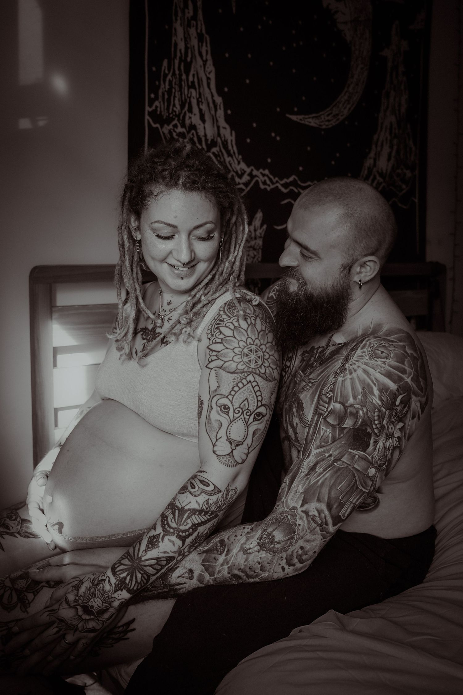 Emotive at home maternity photoshoot ,tattooed gorgeous couple in love, captured in Suffolk by Untamed Muses