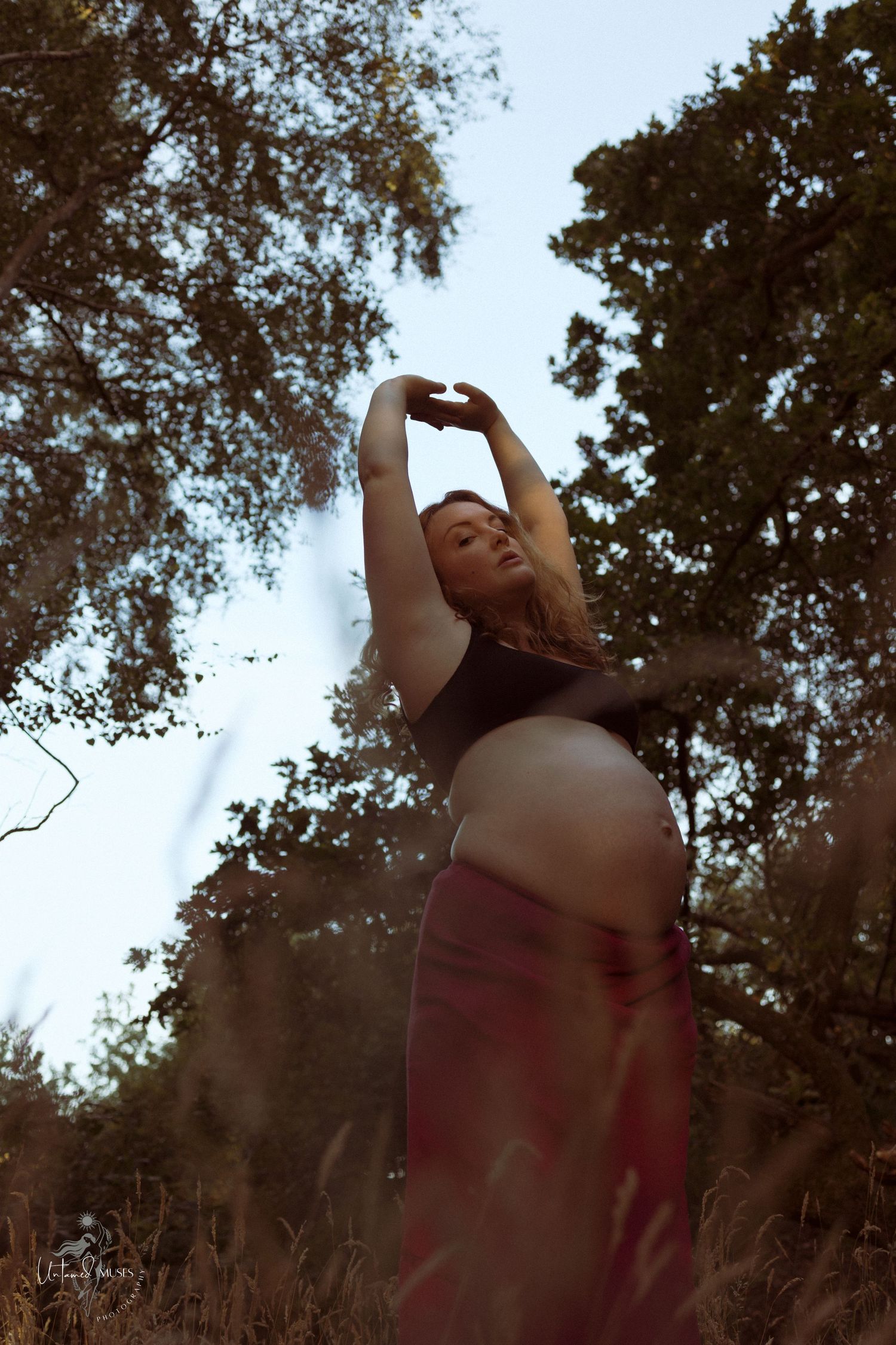 Beautiful low sun evening ,pregnant woman stretching , sensual reclamation, empowerment, natural light , Norfolk woodland, Untamed Muses
