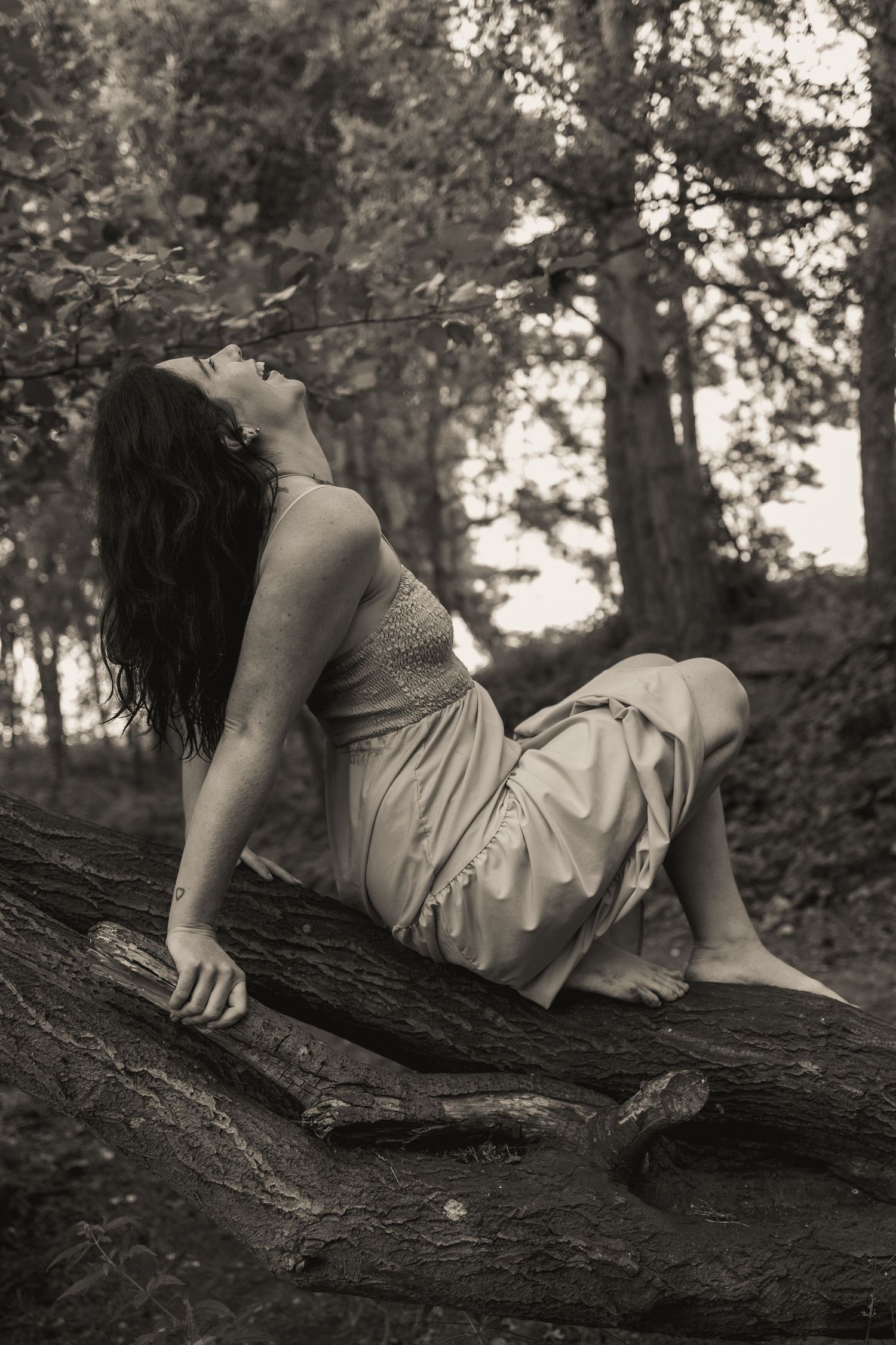 Natural light, empowerment boudoir photography, wild in nature, divine feminine, woman laughing , grounded, free, monochrome, Norfolk