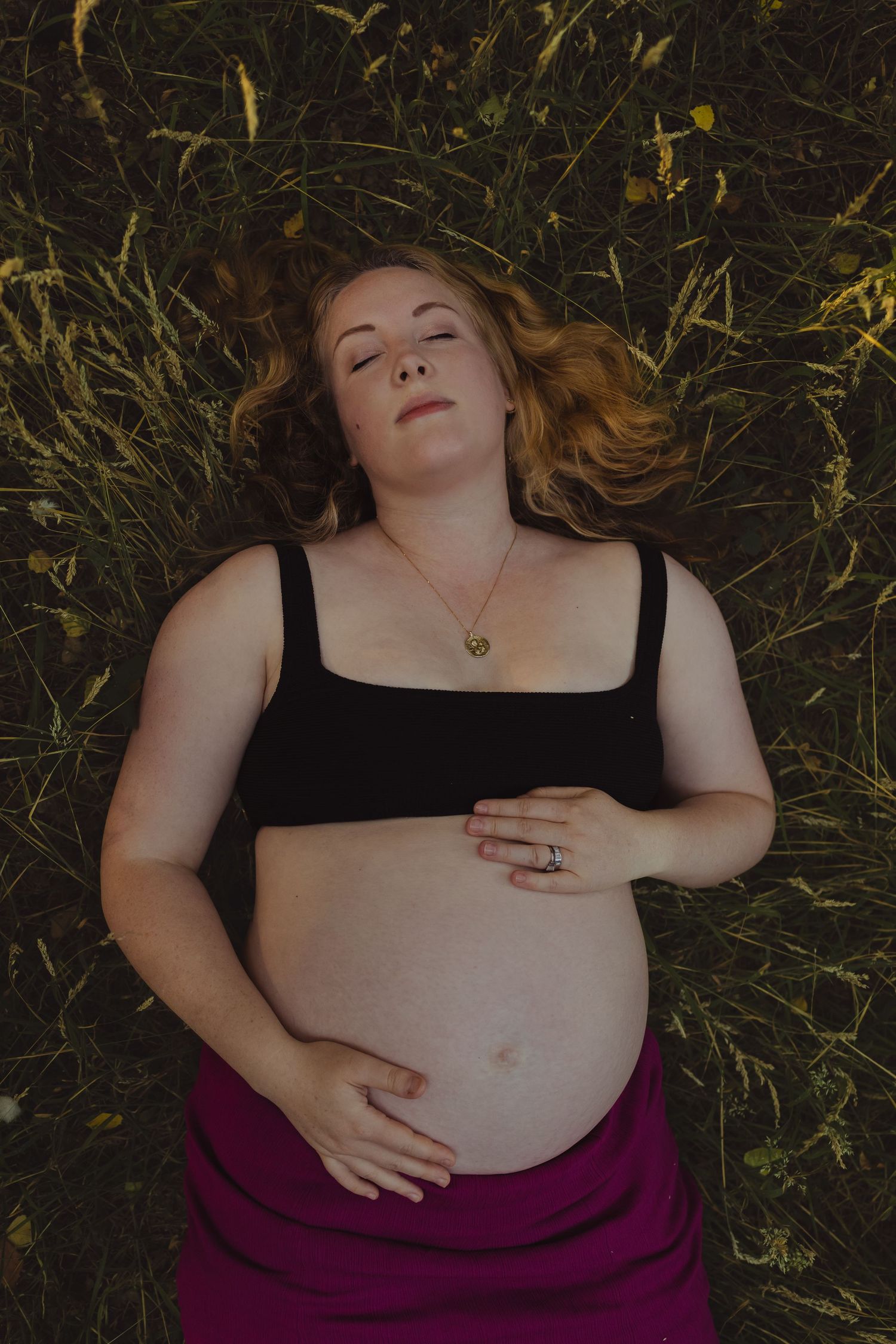 Portrait of pregnant mother, laid on the ground in the forest, one with nature but Untamed Muses