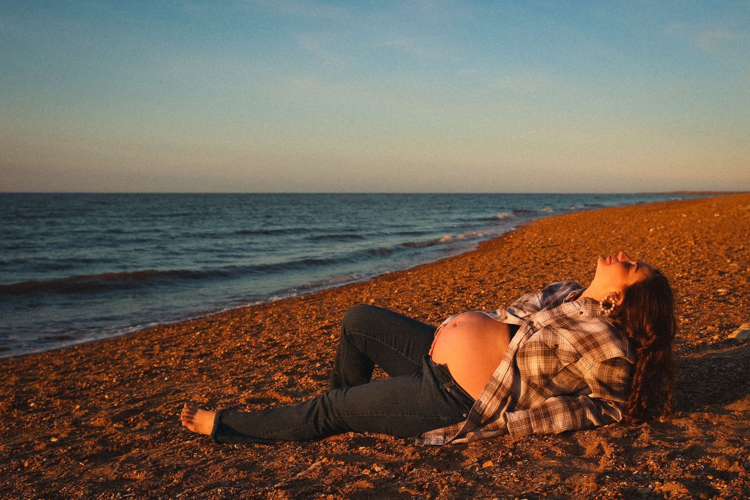 Empowerment maternity outdoors photoshoot in Norfolk beach during sunset by untamed muses