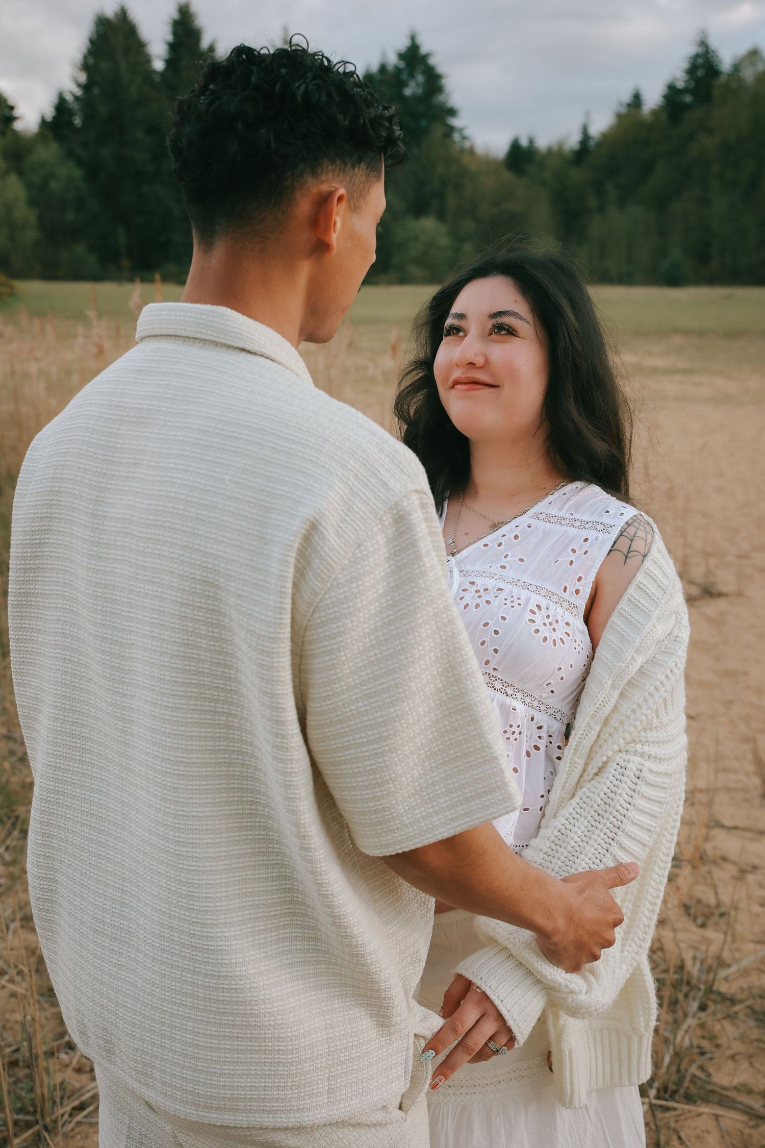 candid moment during maternity photoshoot with untamed muses photography , outdoors during a spring evening in Norfolk