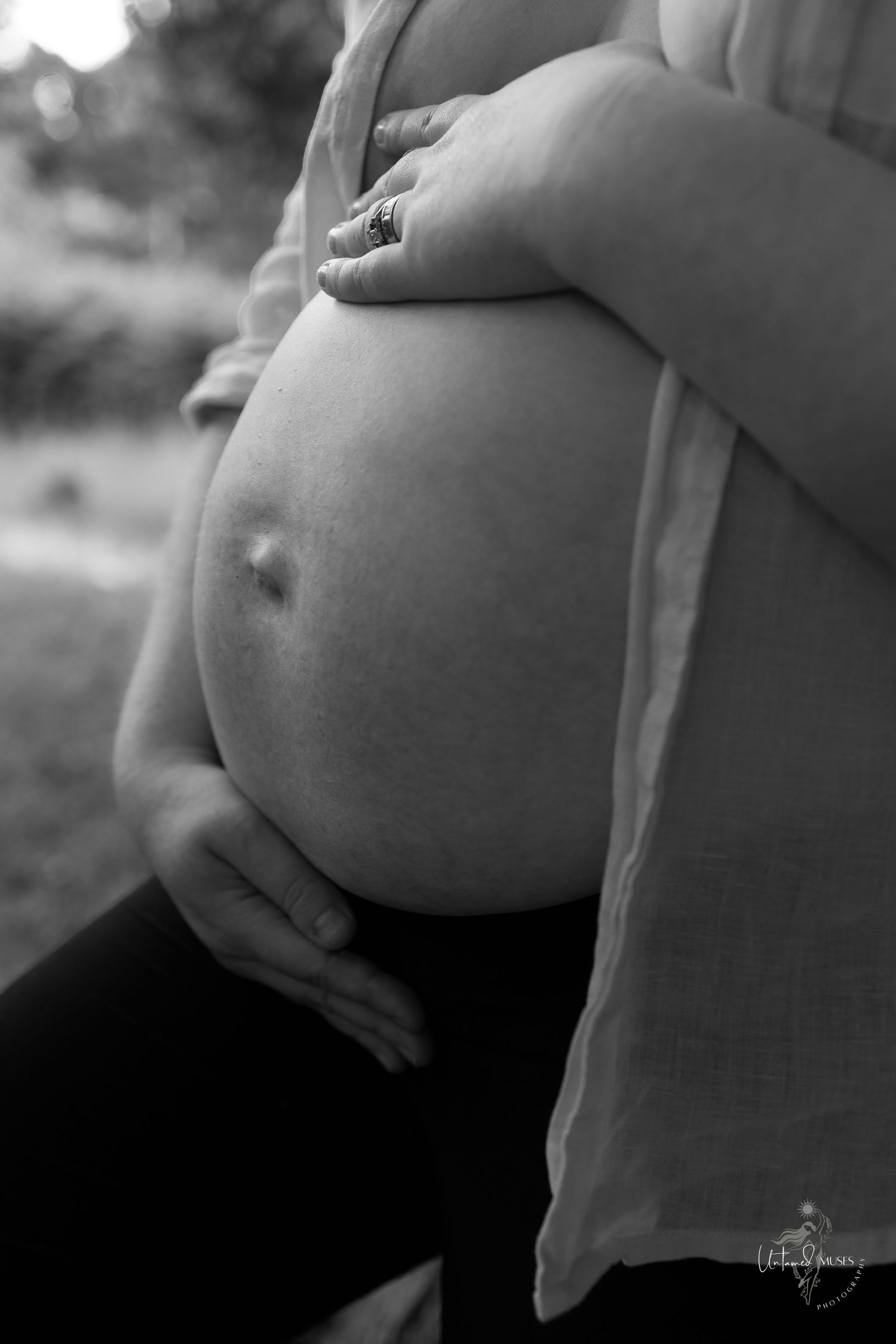 close up, monochrome of pregnancy bump, mum leaning on tree, shirt open, Norfolk woods, by female gaze empowerment photography Untamed Muses
