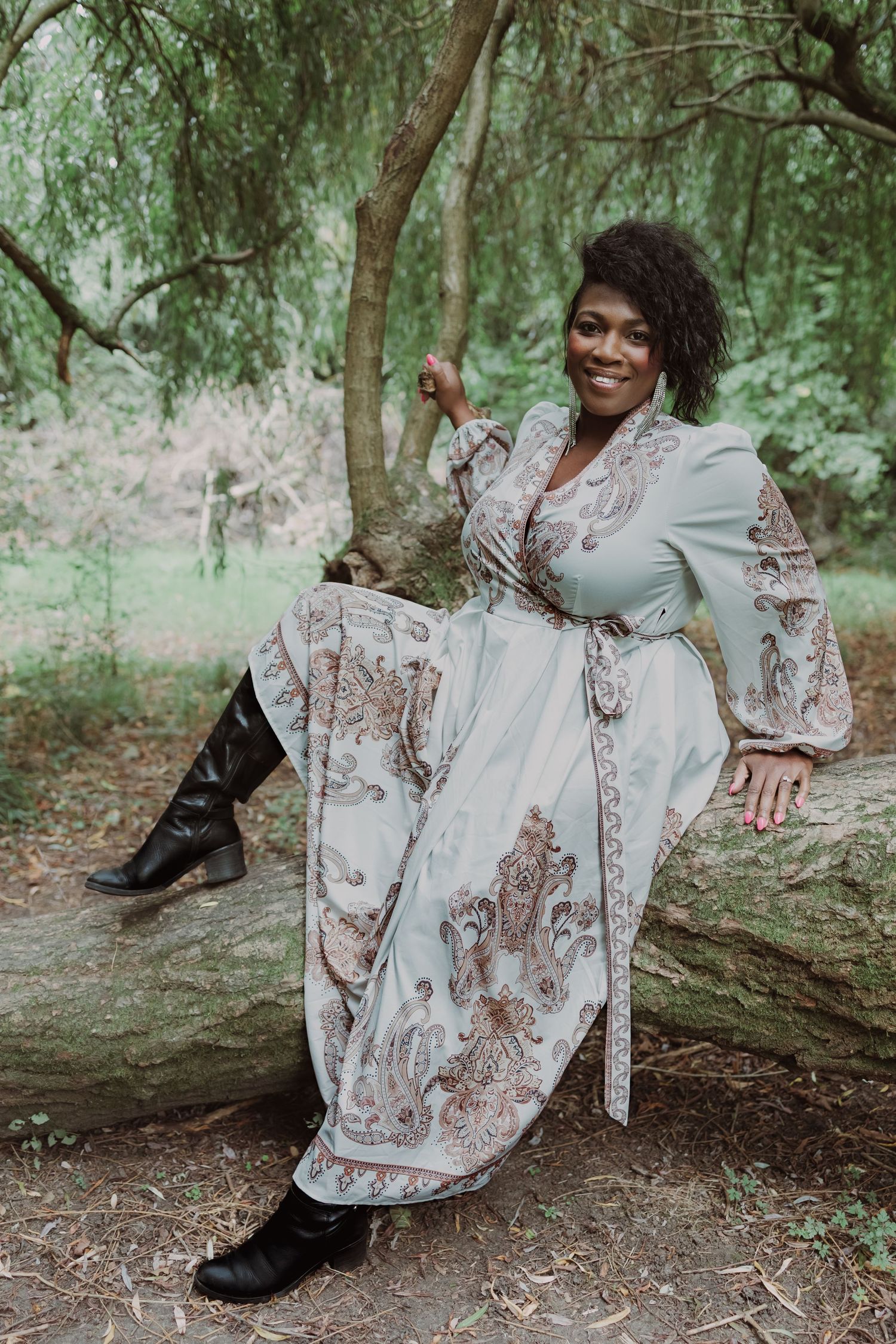 Personal branding photography norfolk, suffolk, outdoors portrait of beautiful woman in dress on a tree, colour, smiling