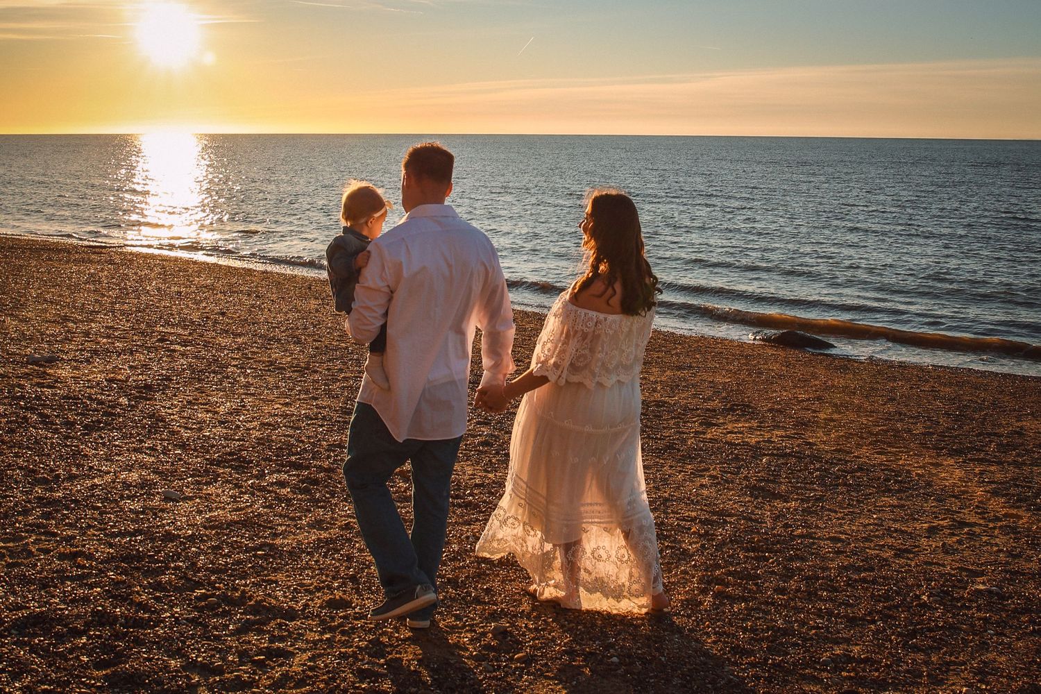 Lifestyle Family photographer in Norfolk, captured outdoors maternity photography in golden light, showcasing connection by untamed muses