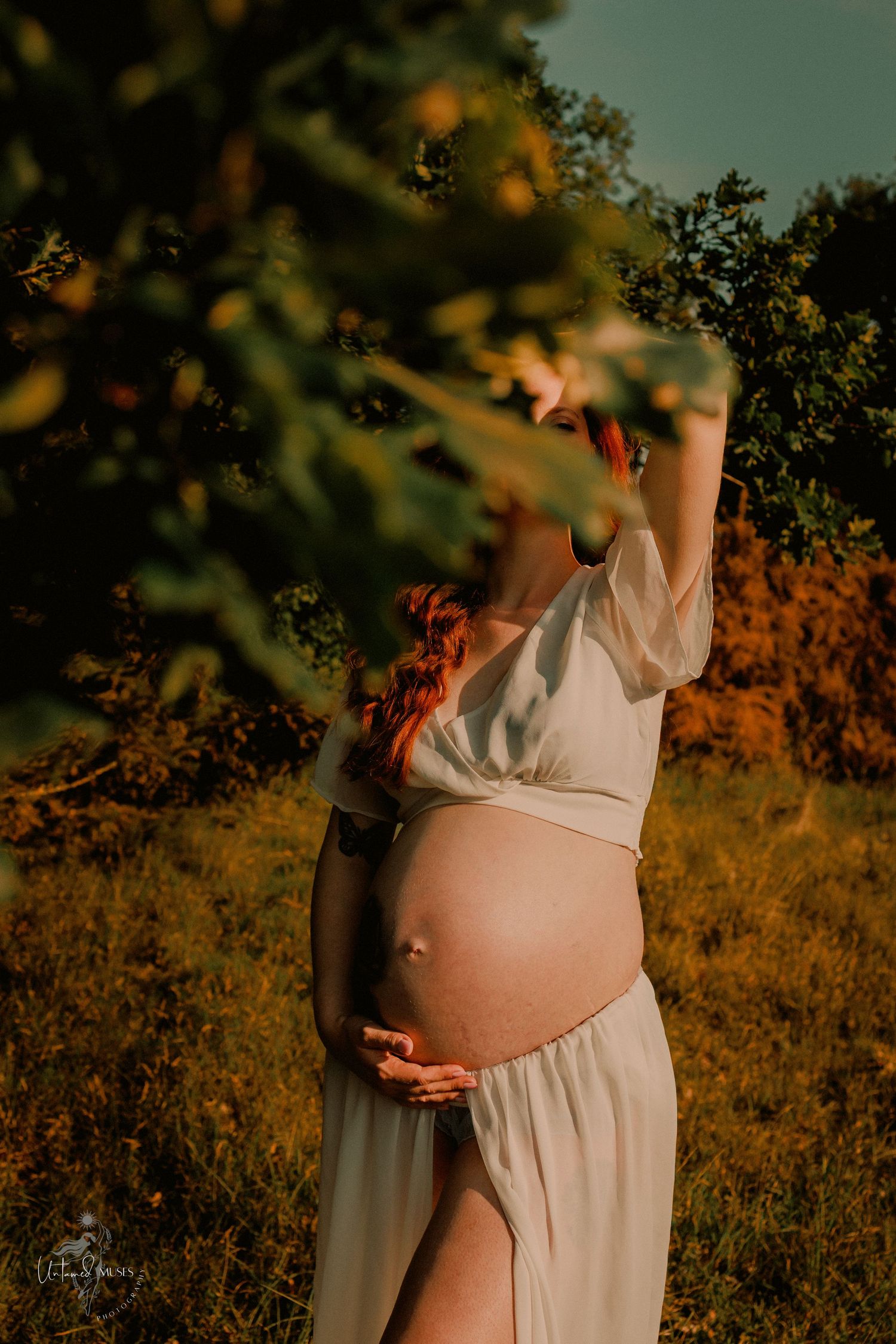 Empowerment boudoir maternity photoshoot, radiant pregnant woman in nature, colour, natural light, Thetford, untamed muses