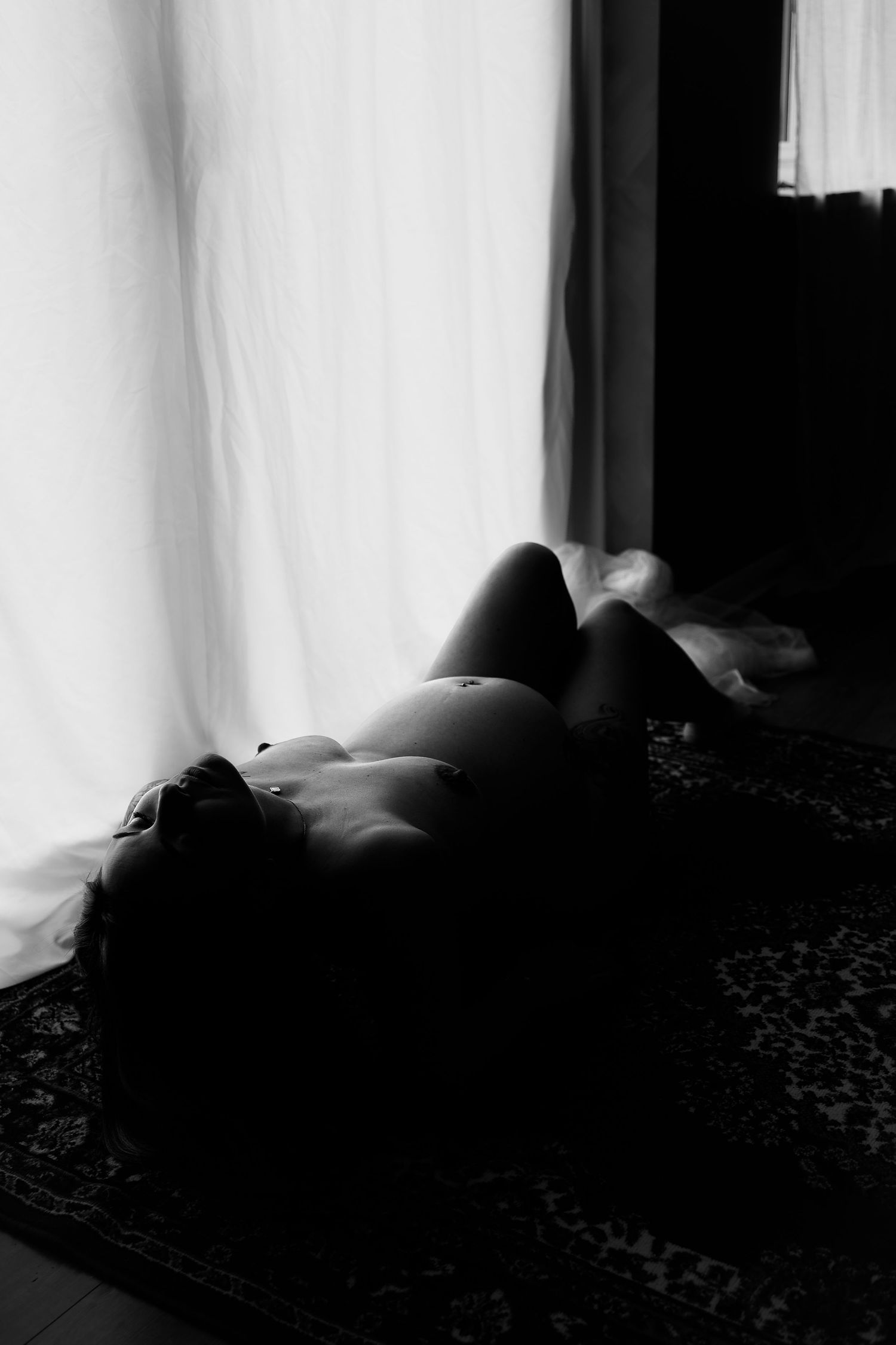 Maternity boudoir redefined, female gaze empowerment, elegant portraiture in Suffolk and Norfolk by Untamed Muses, monochrome