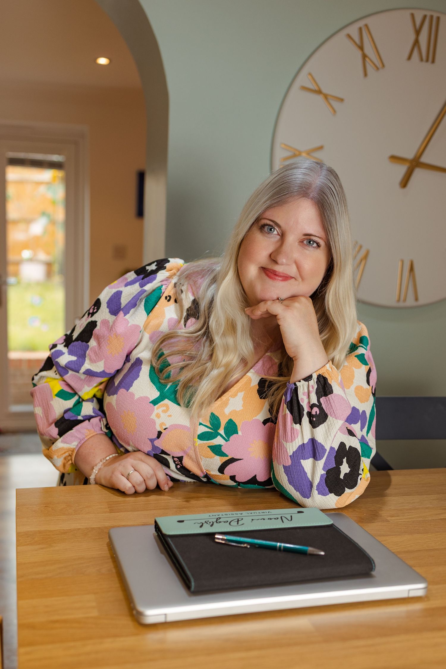 personal branding, virtual assist, portrait at home, colour, woman leaning on table, confident
