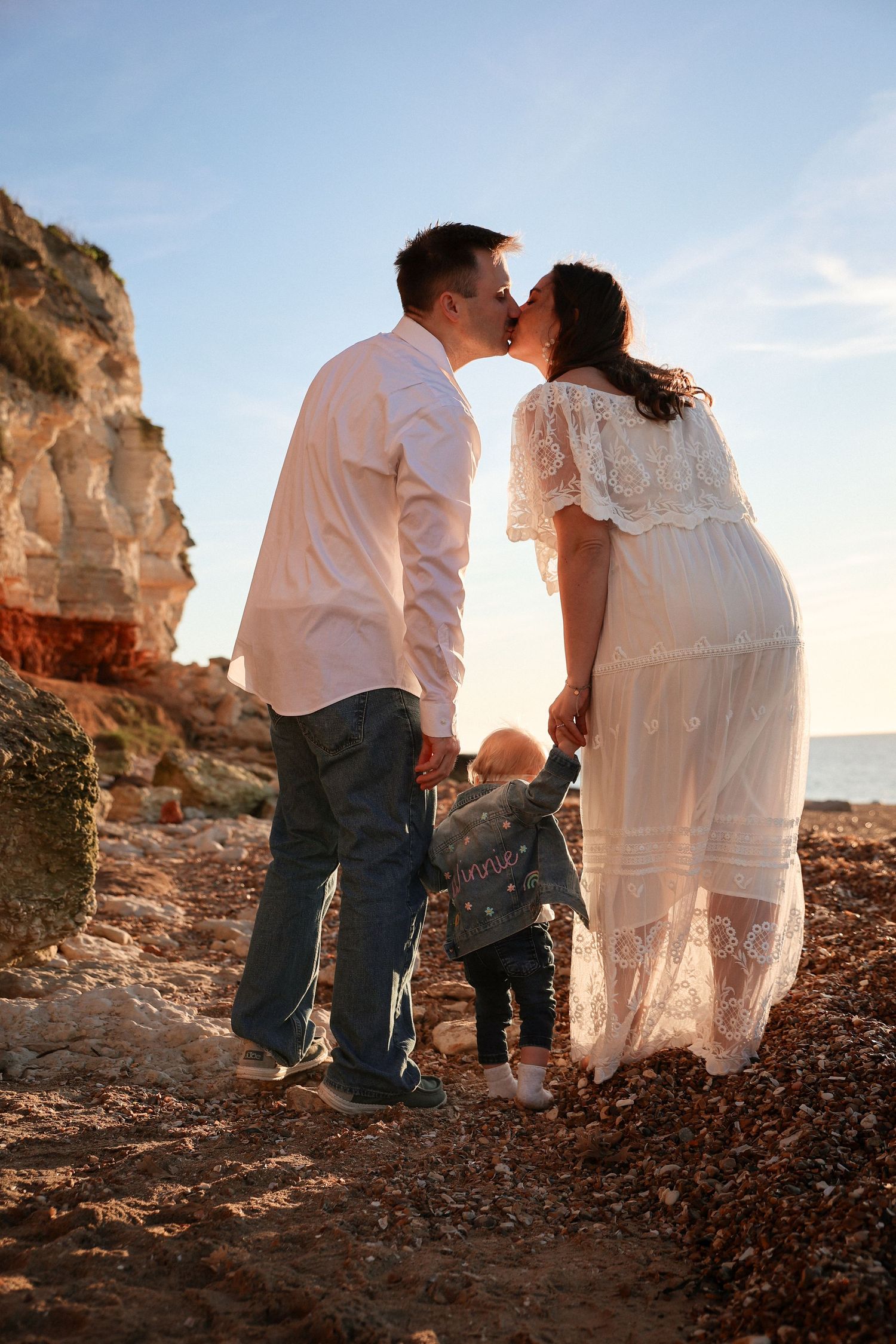Tender moment during family photography in Norfolk , Military family photoshoot by Untamed Muses, emotive,  soulful
