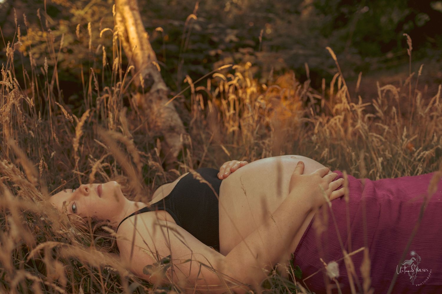 Beautiful low sun evening ,pregnant beauty laying on ground , sensual reclamation, empowerment, natural light