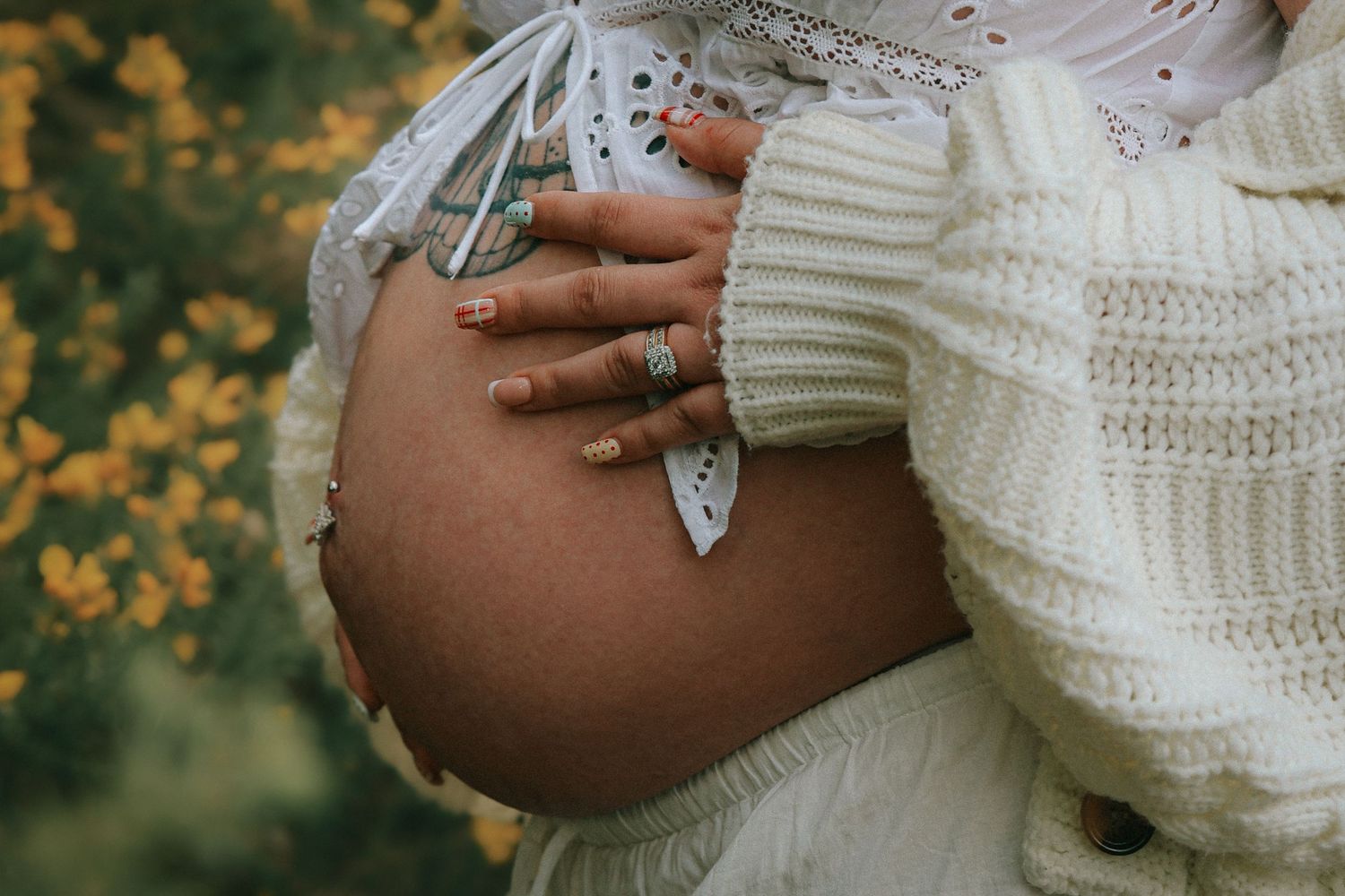 Hands on Bump detail, during maternity photoshoot with untamed muses photography , outdoors during a spring evening in Norfolk