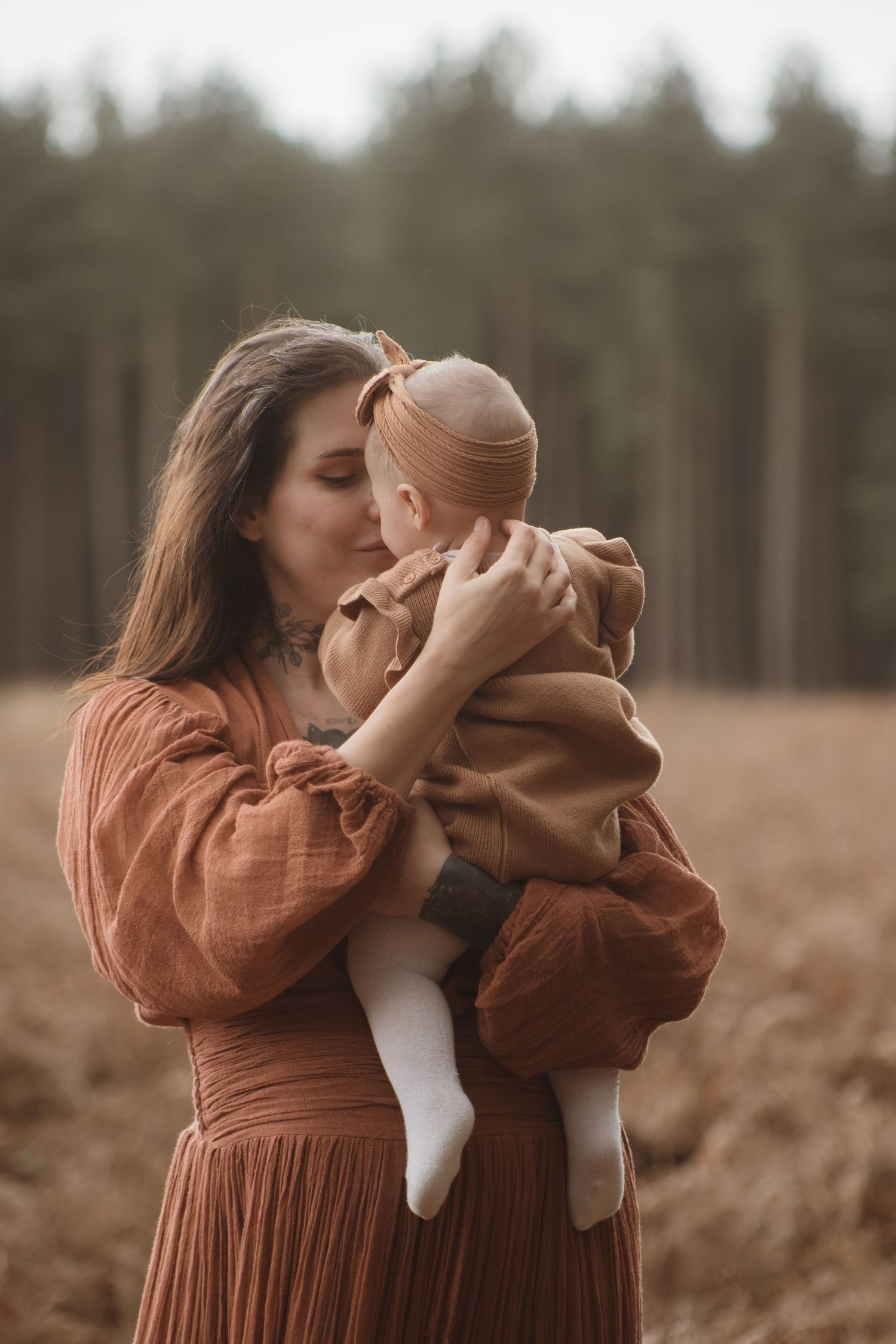 emotive portrait of mother holding baby in the woods, timeless photography for women, thetford