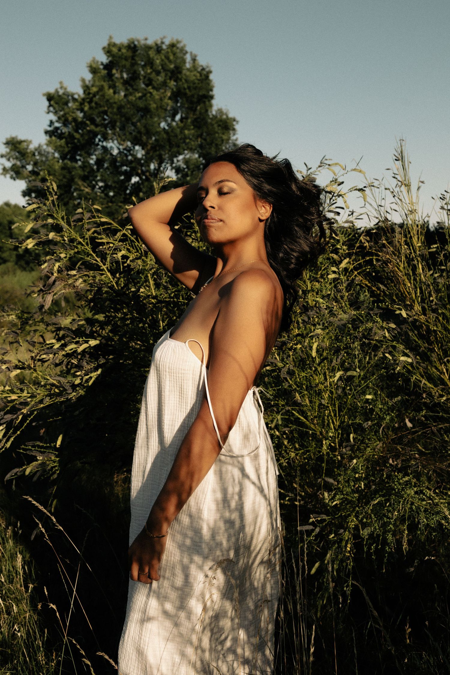 Hispanic woman stood up win her power, beautiful and confident feeling the wind ,colour, natural light, outdoors