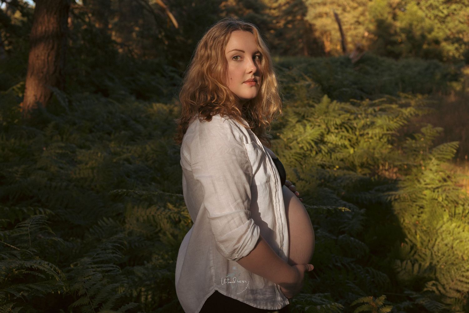 captivating portrait of maternity wild in nature empowerment photography , female gaze photographer in Thetford, golden light in forest