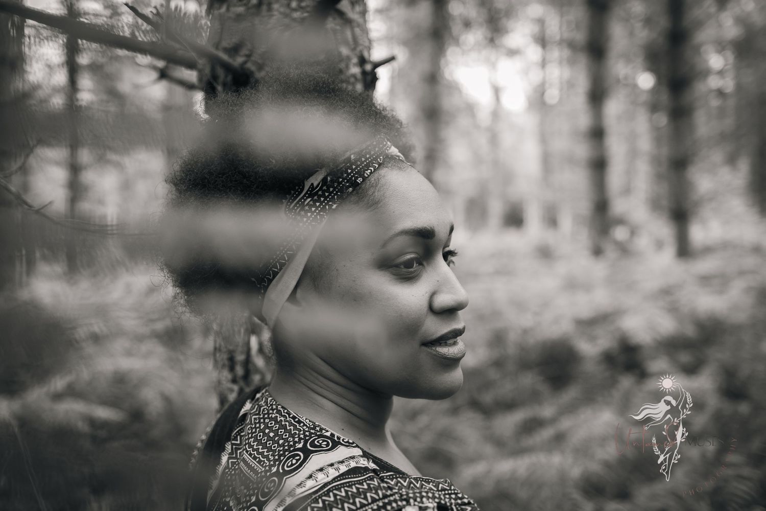 Monochrome portrait of gloriously gorgeous black woman walking in the forest