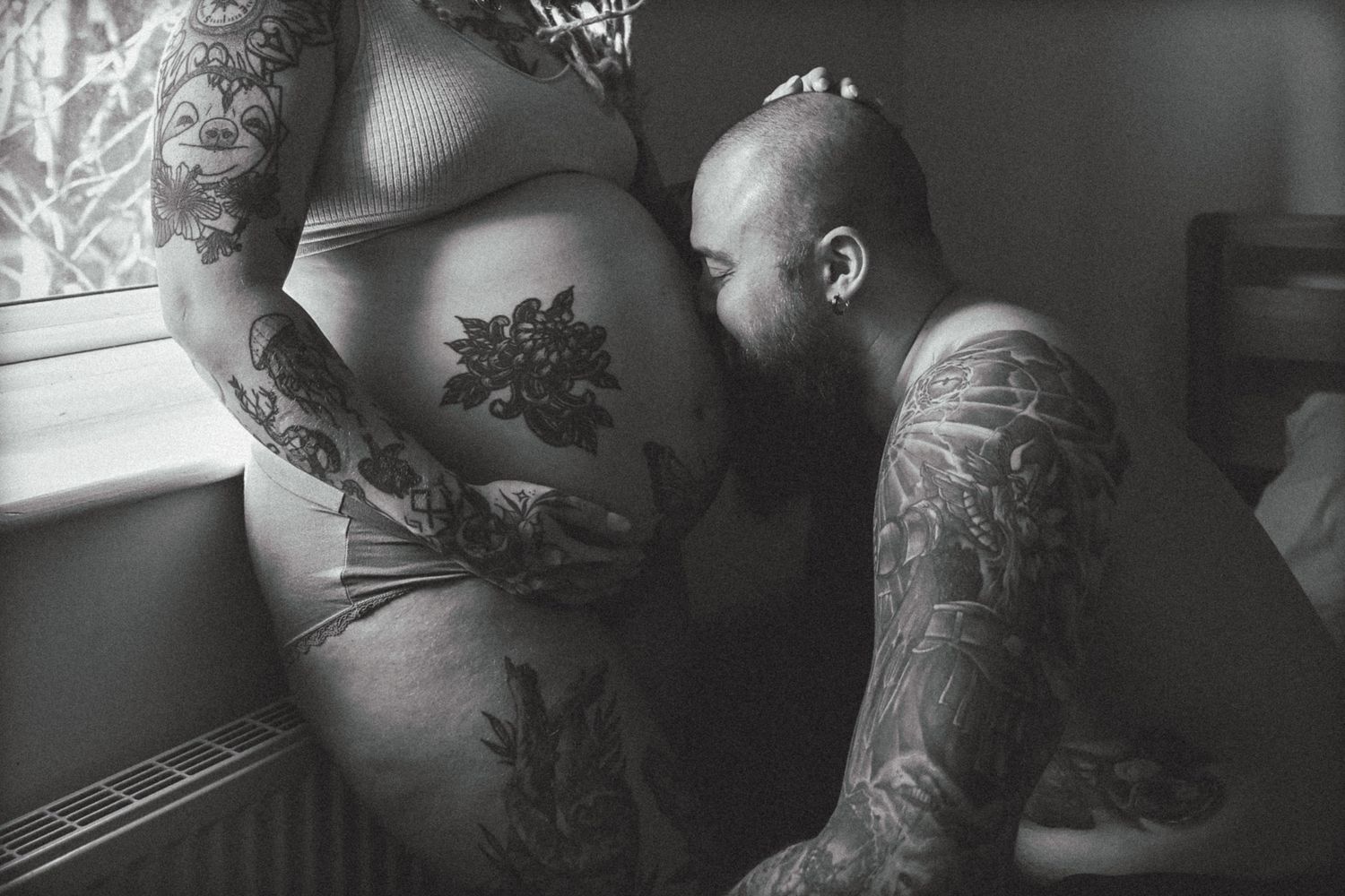 Monochrome emotive documentary photography of pregnancy, tattooed couple at home by Untamed Muses Norfolk