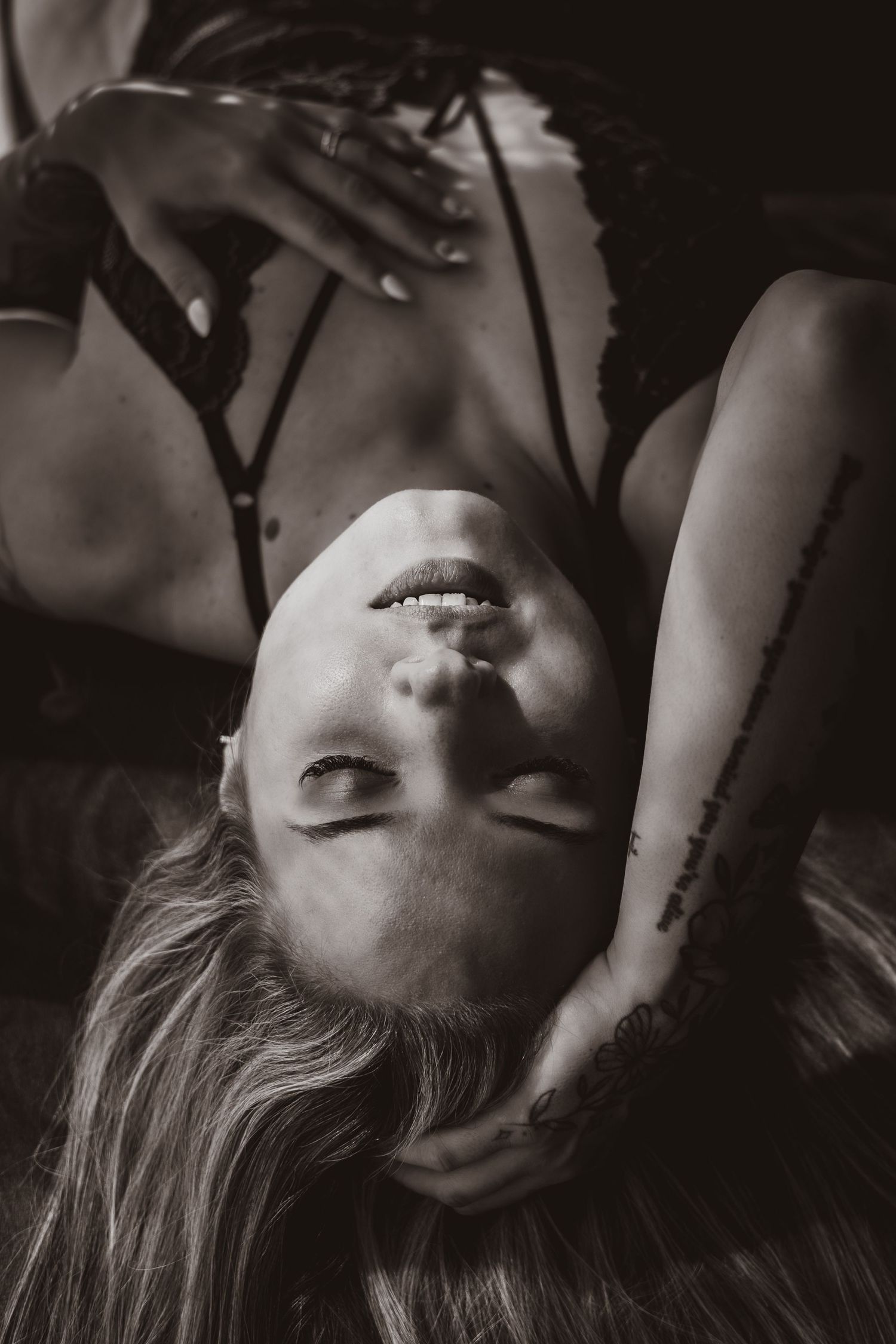 Monochrome close up portrait of woman during an empowerment boudoir photoshoot in Norfolk , classy, elegant , timeless