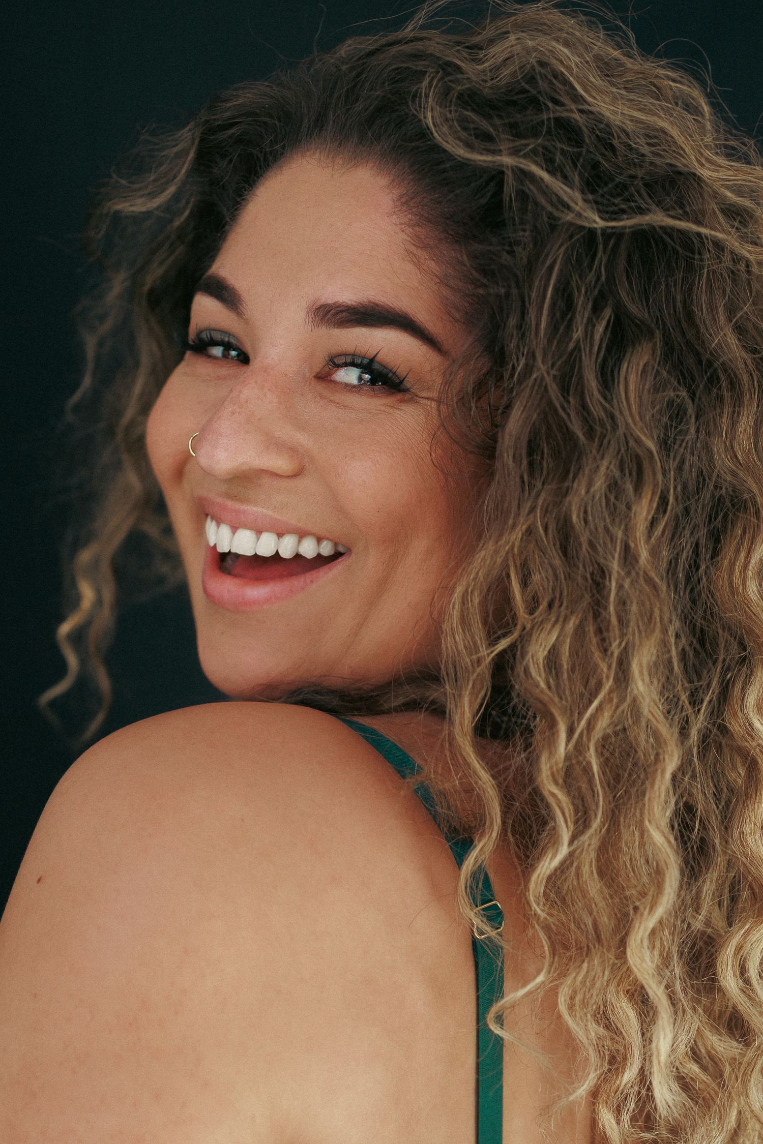 Close up portrait of woman smiling during an body inclusive empowerment photoshoot at Untamed Muses in Thetford