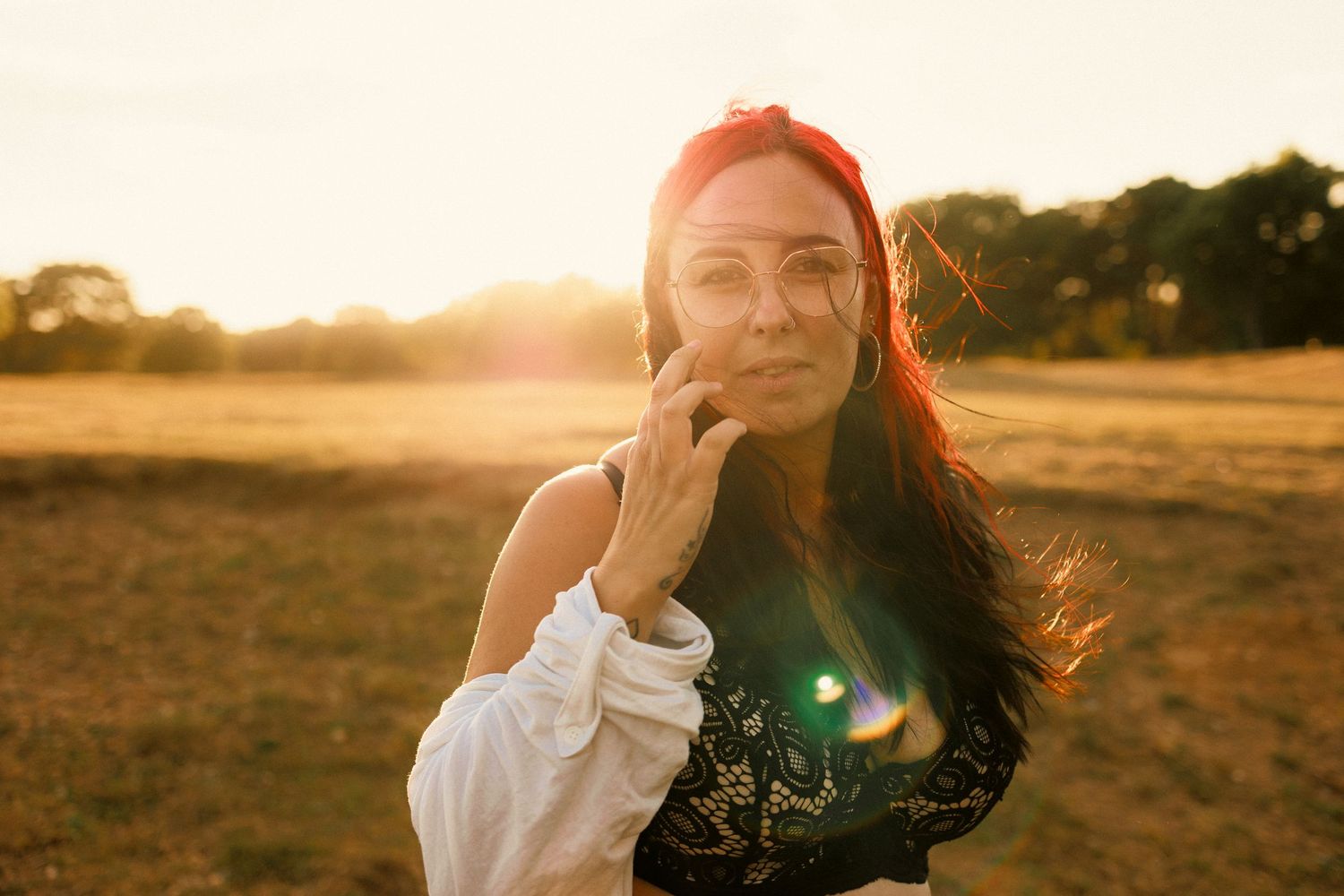 portrait of woman in fields ion summer at golden hour, colour, natural light, outdoors, empowerment. , thetford