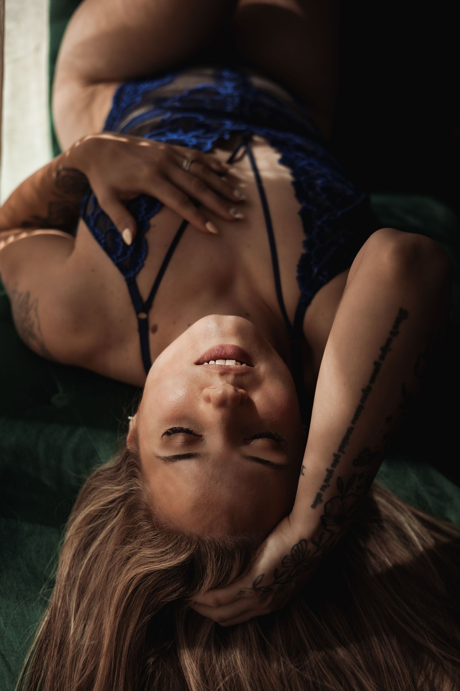 Sultry portrait of woman owning her magic during a female gaze perspectibe empowerment boudoir photoshoot in Norfolk,