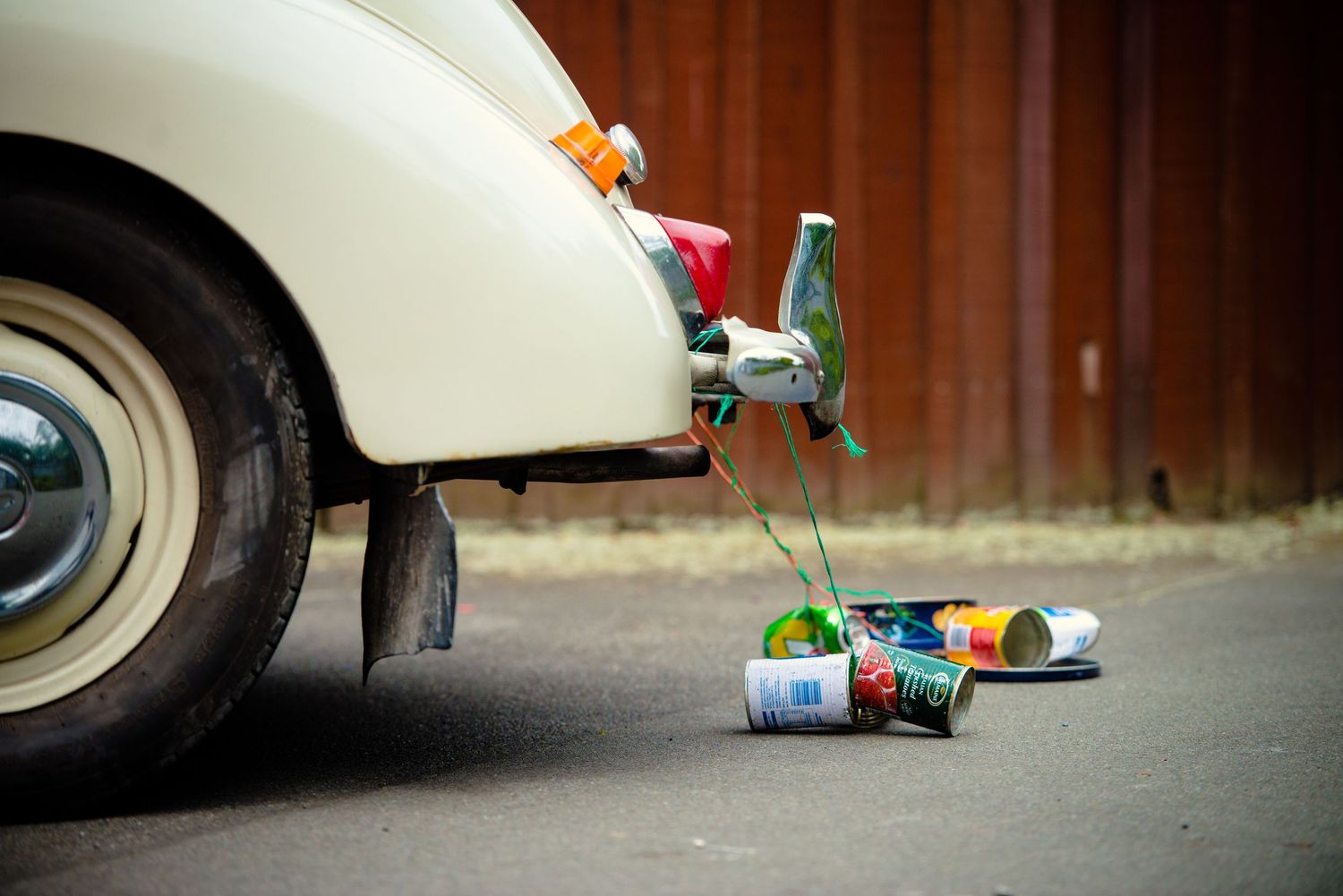 St Albans Christchurch wedding - cans dragging behind wedding car